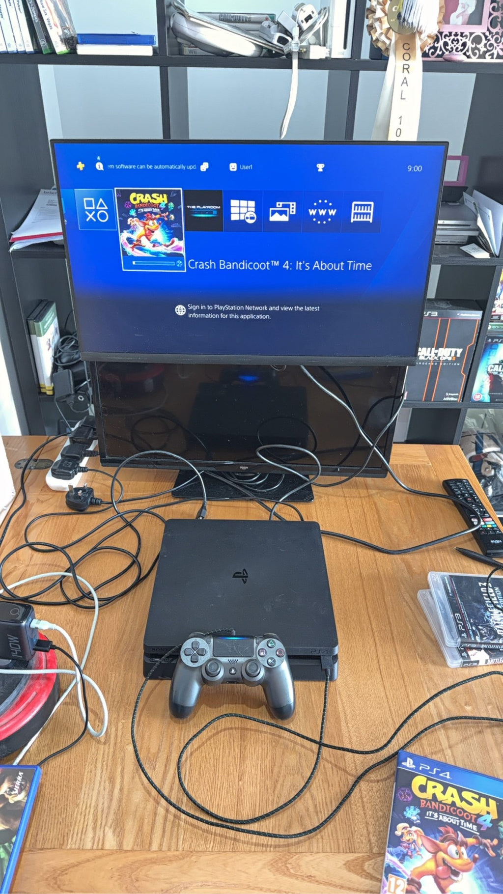 Sony PlayStation 4 Slim 500GB black console with one controller, power and HDMI cables.