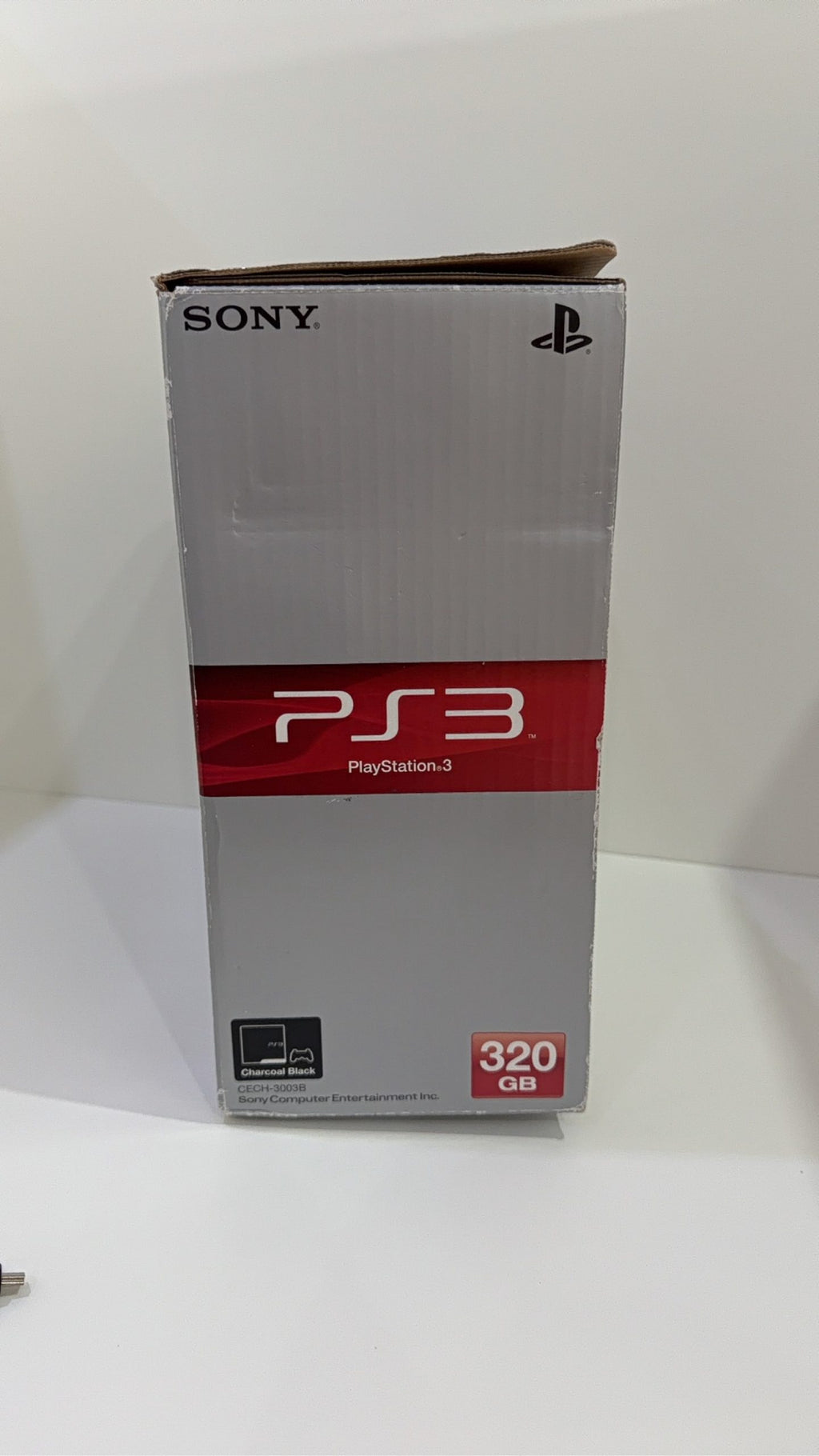 Sony PlayStation 3 PS3 320GB boxed console with official controller, cables, and original booklet.