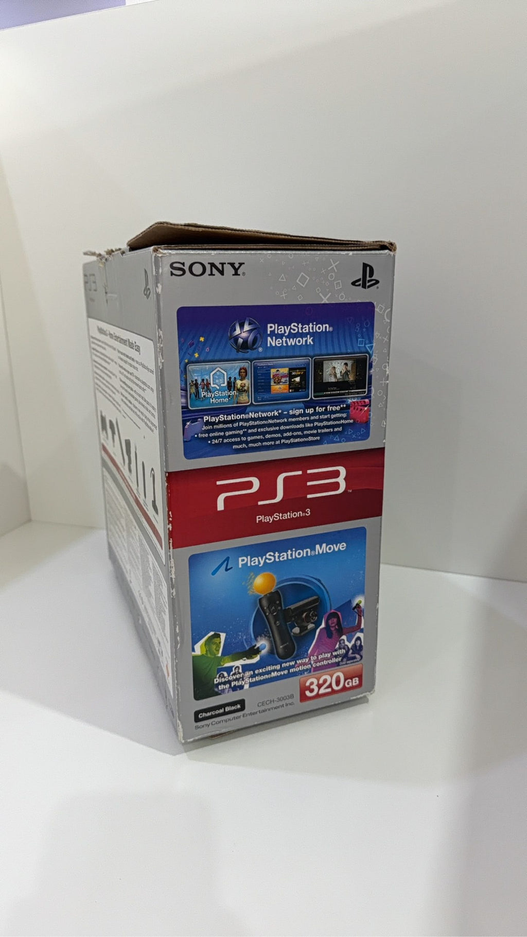 Sony PlayStation 3 PS3 320GB boxed console with official controller, cables, and original booklet.
