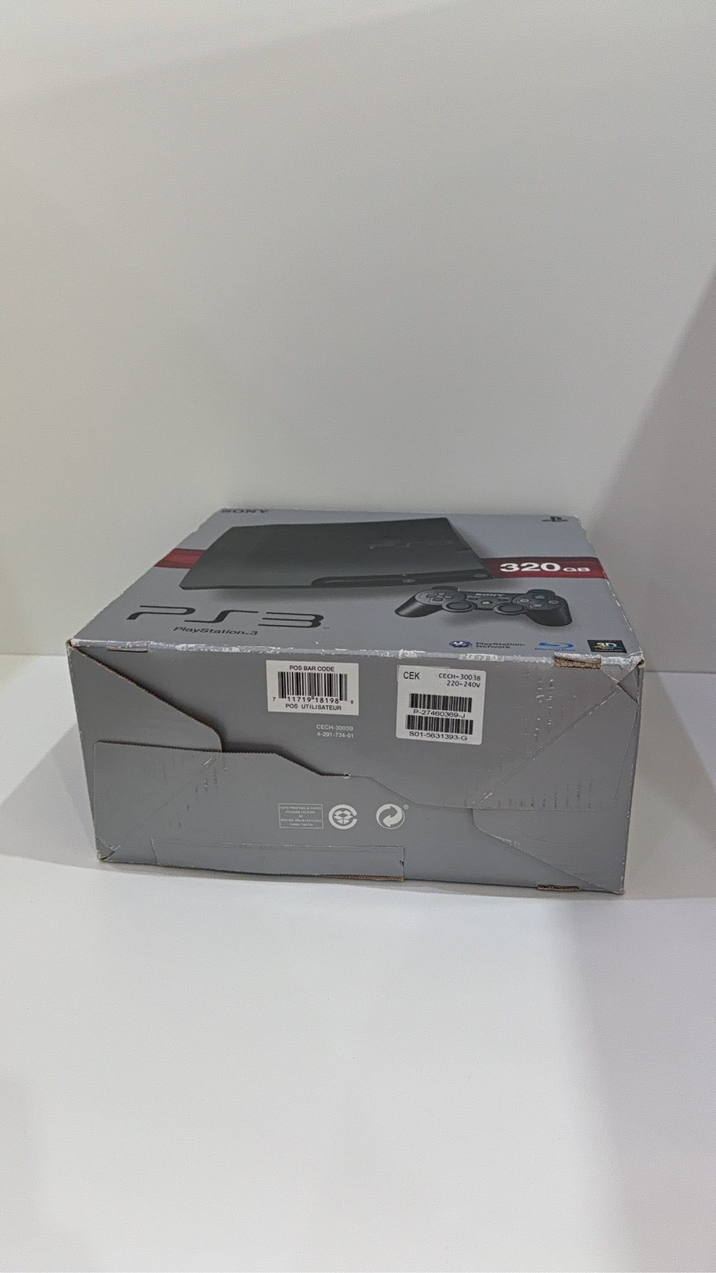 Sony PlayStation 3 PS3 320GB boxed console with official controller, cables, and original booklet.