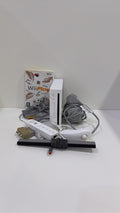 White Nintendo Wii console bundle with official Wii Remote, Nunchuk, cables, and Wii Play game.