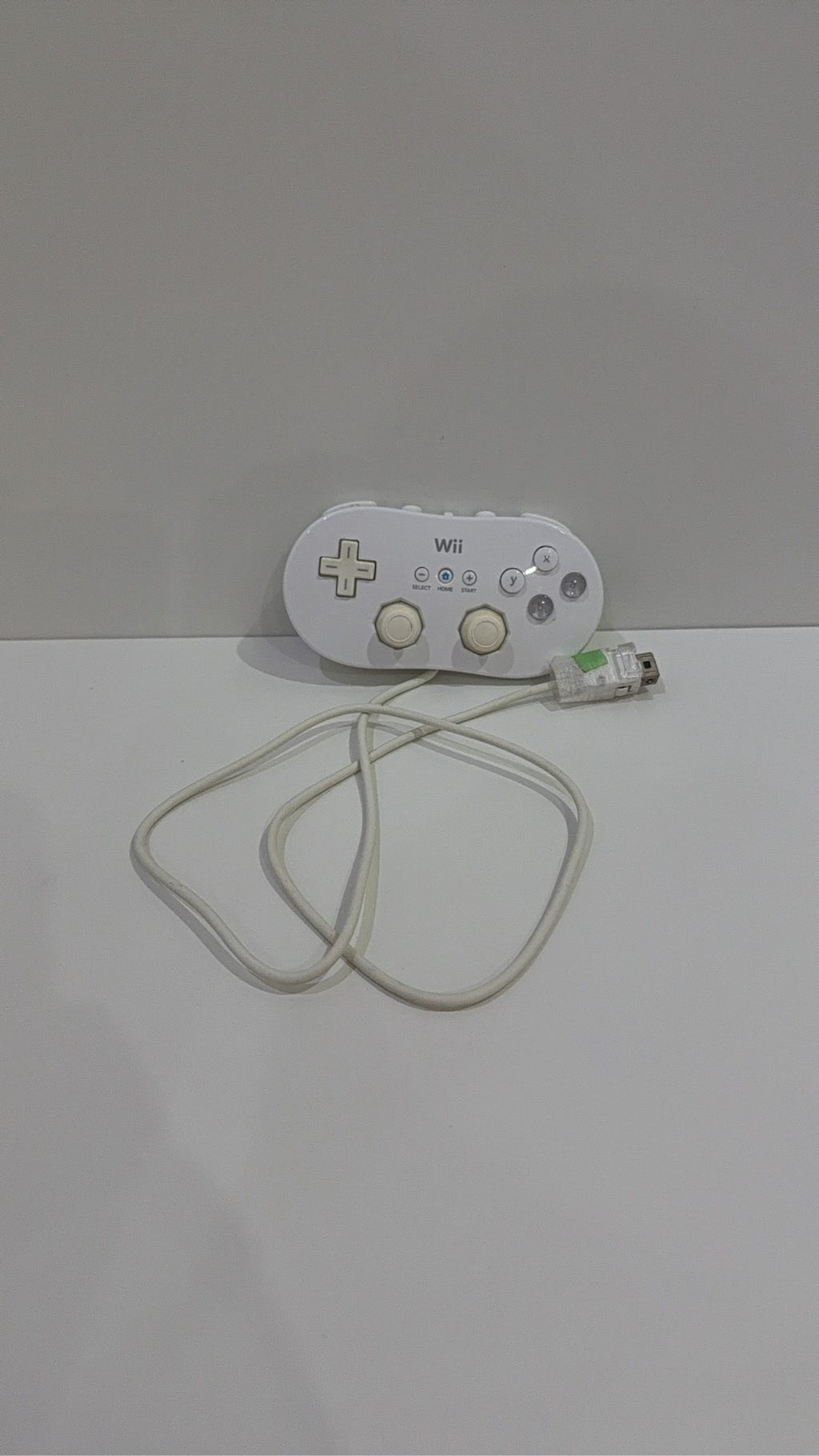 Official Nintendo Wii Classic Controller in white, genuine accessory, fully working condition.