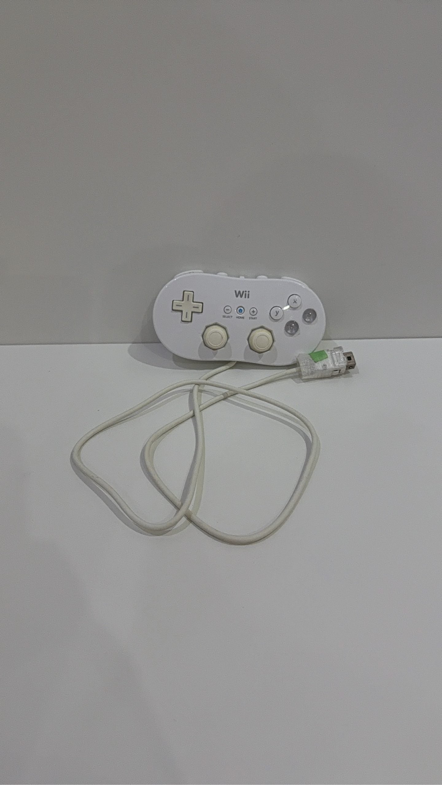 Official Nintendo Wii Classic Controller in white, genuine accessory, fully working condition.