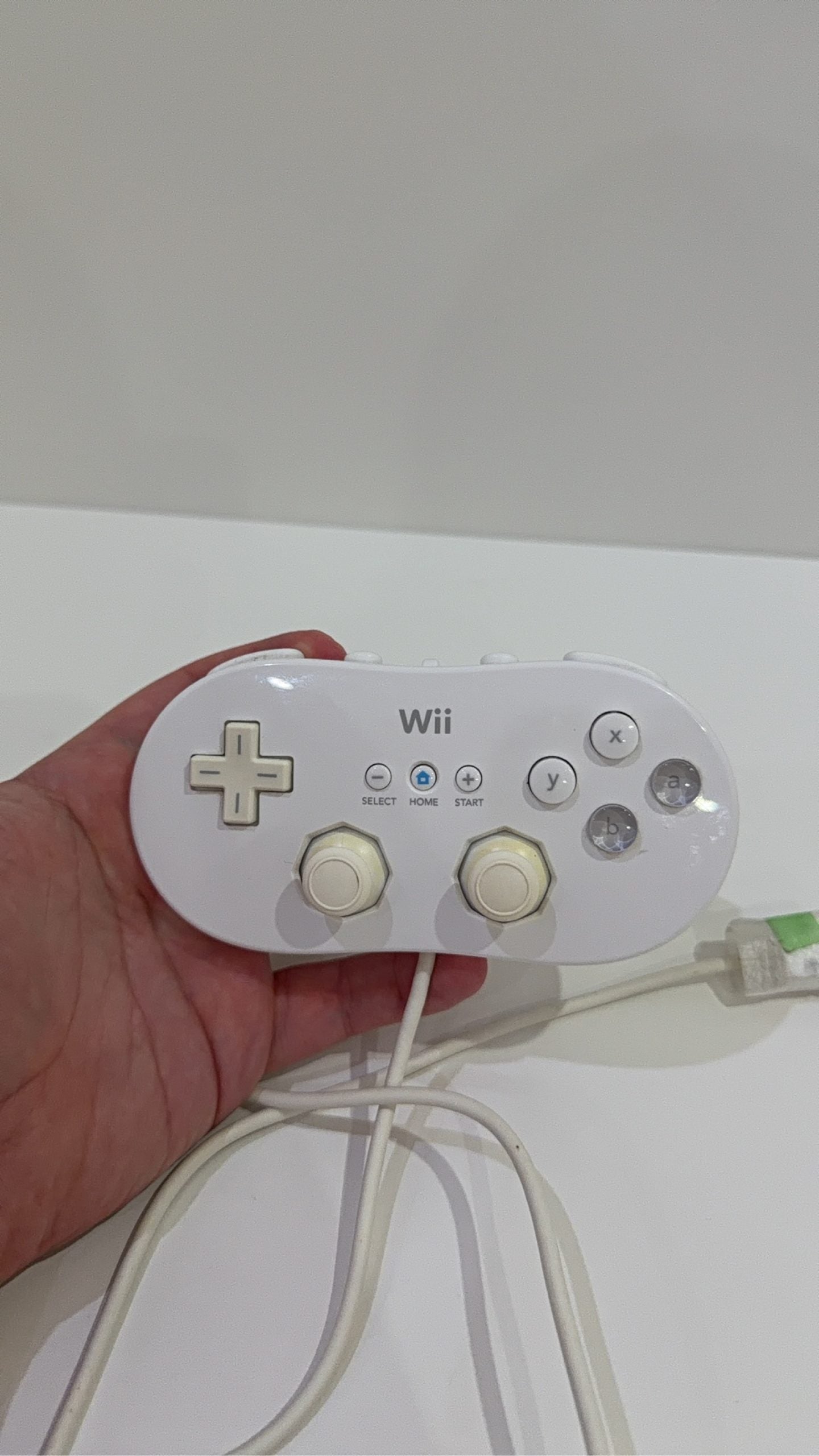 Official Nintendo Wii Classic Controller in white, genuine accessory, fully working condition.