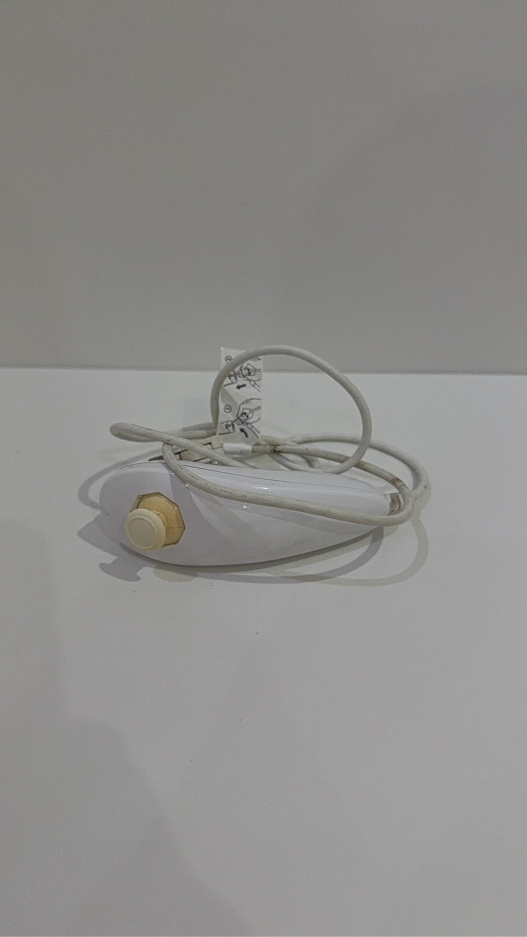 Official Nintendo Wii Nunchuk Controller in white, genuine accessory, tested and working.