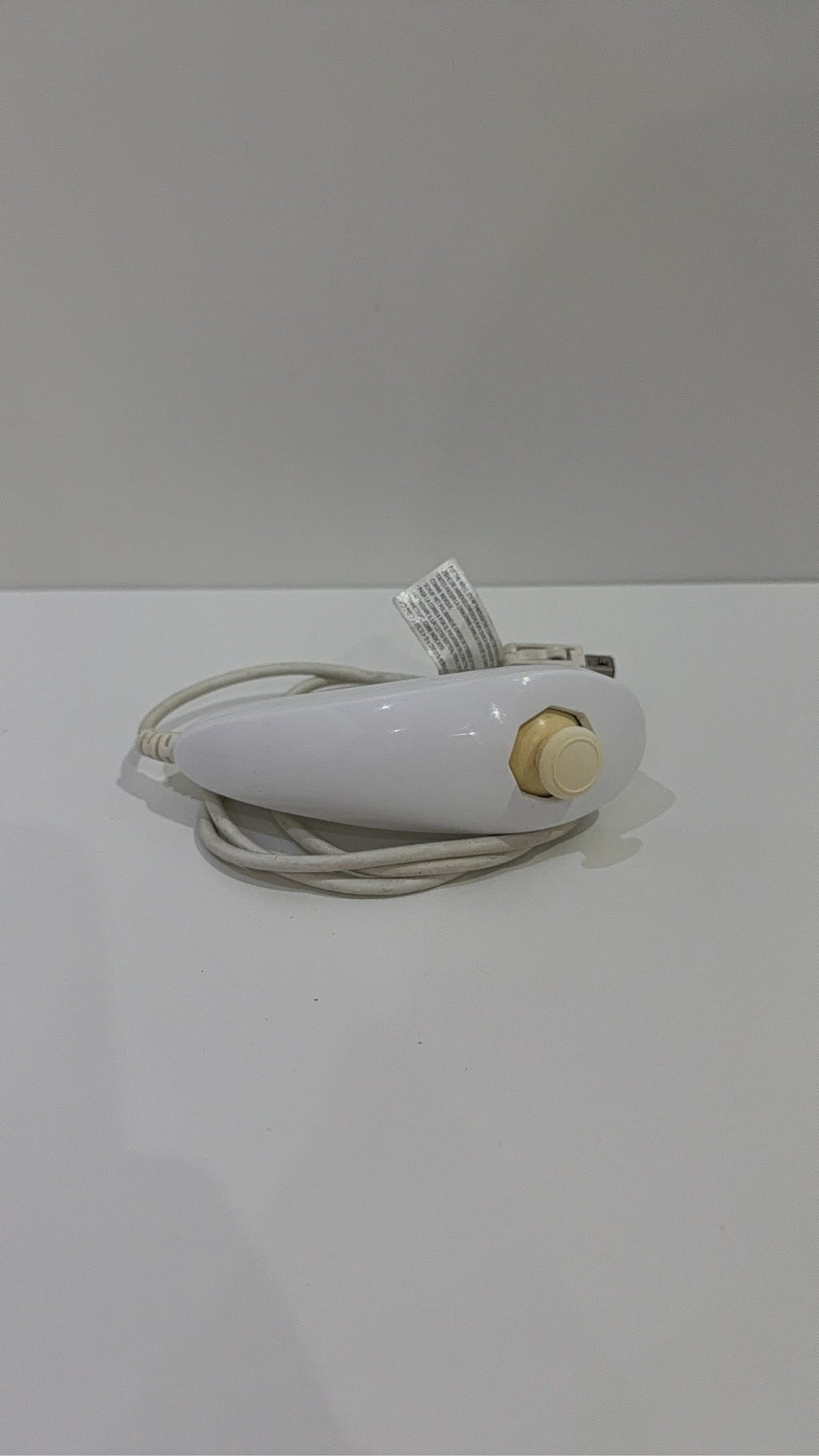Genuine Nintendo Wii Nunchuk Controller in white, fully tested and working, visible wear.