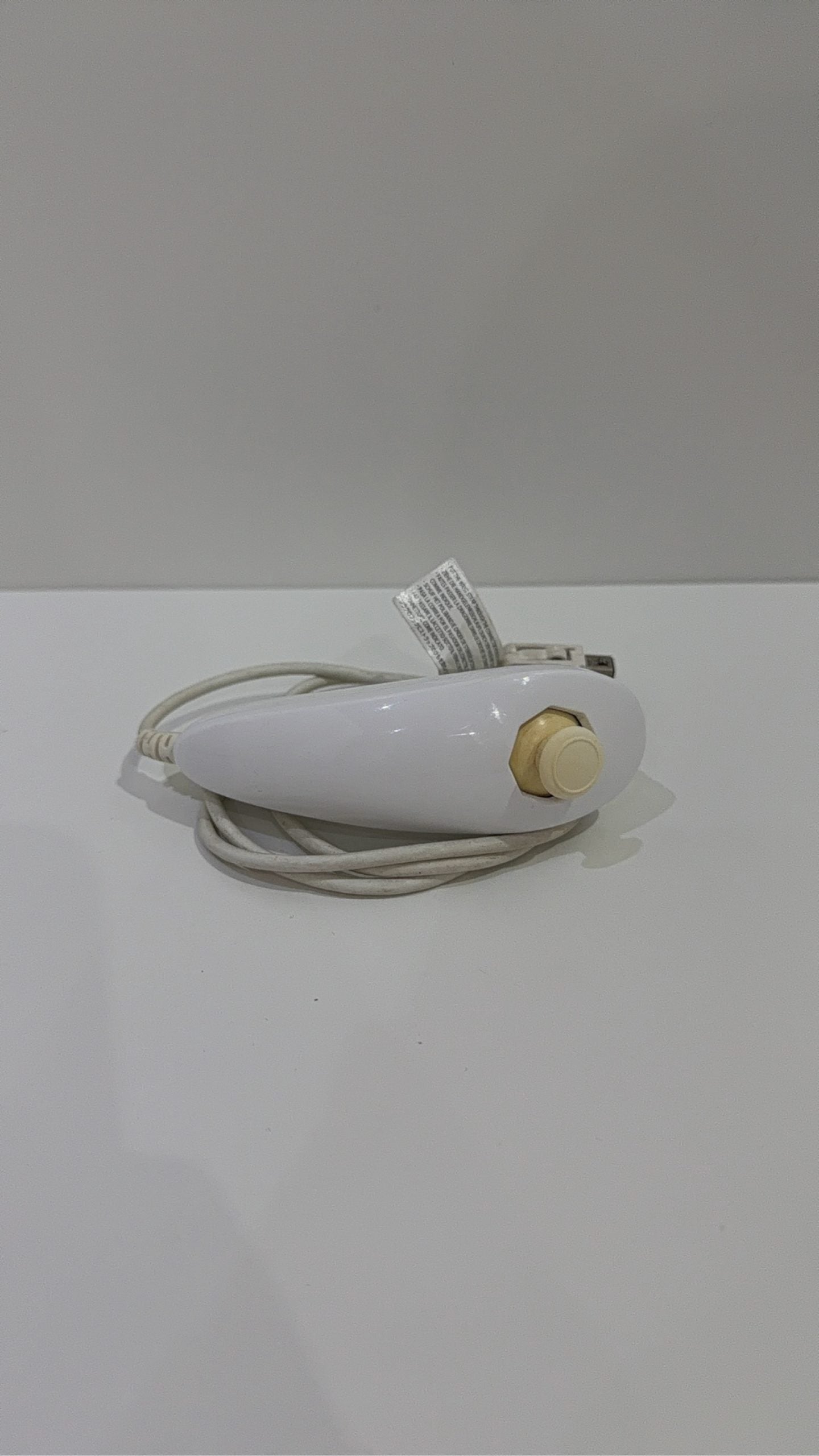 Genuine Nintendo Wii Nunchuk Controller in white, fully tested and working, visible wear.