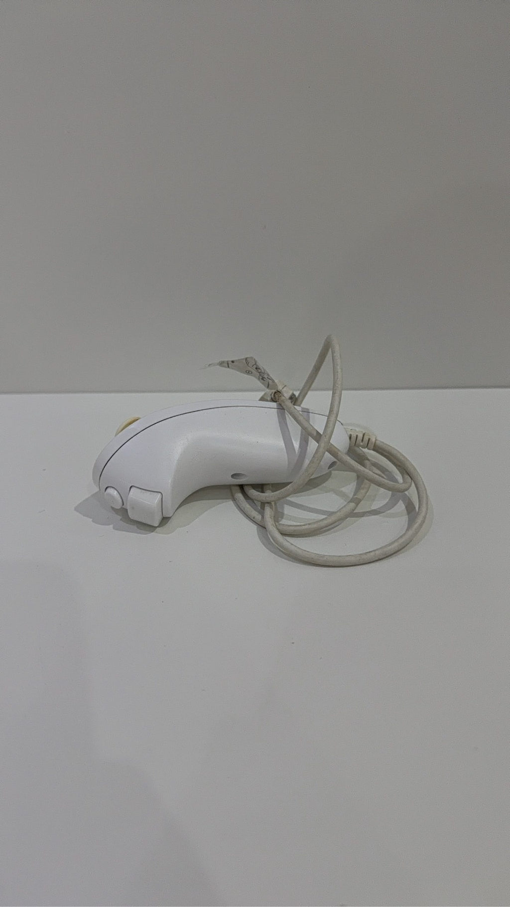 Genuine Nintendo Wii Nunchuk Controller in white, fully tested and working, visible wear.