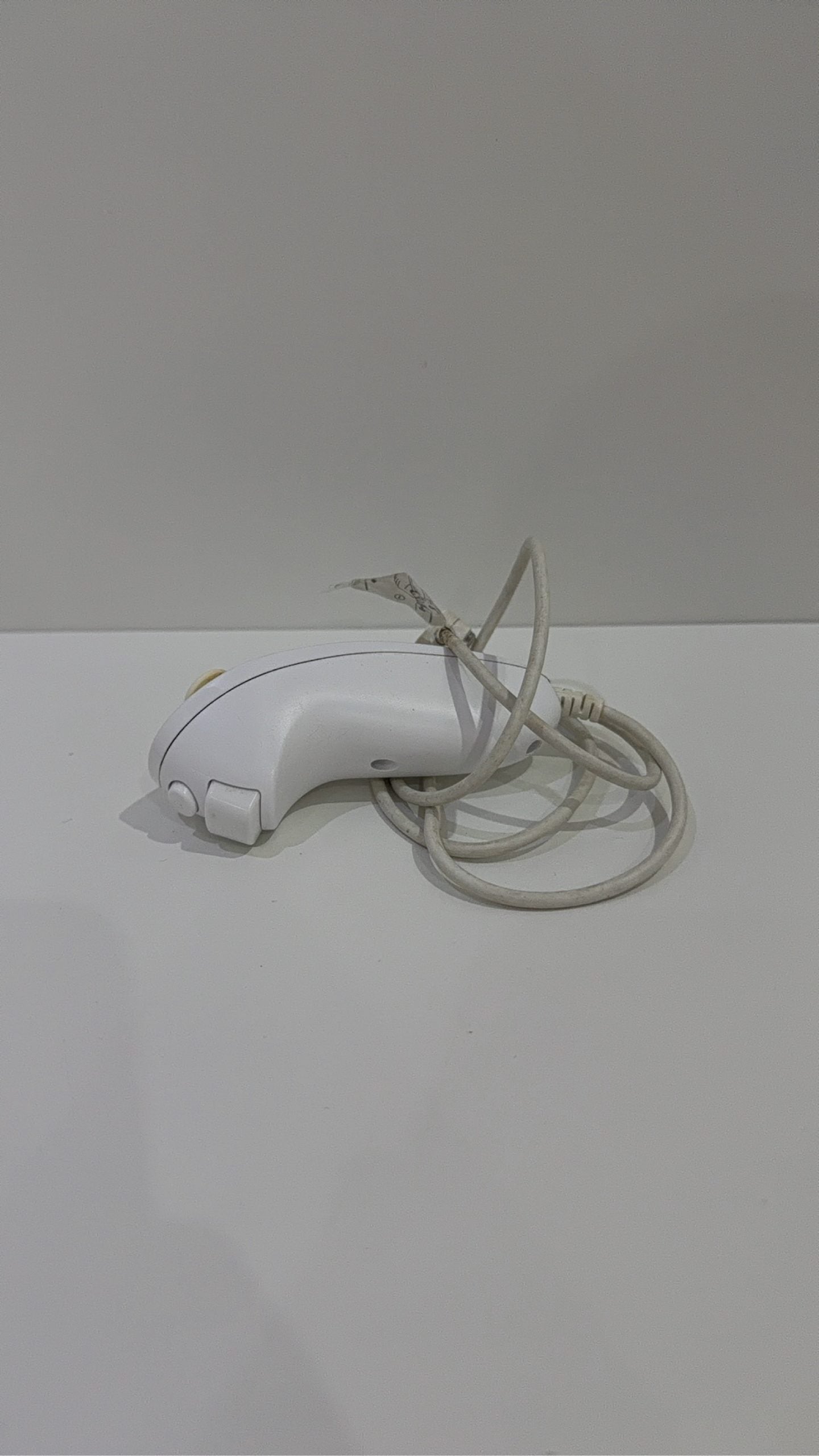 Genuine Nintendo Wii Nunchuk Controller in white, fully tested and working, visible wear.