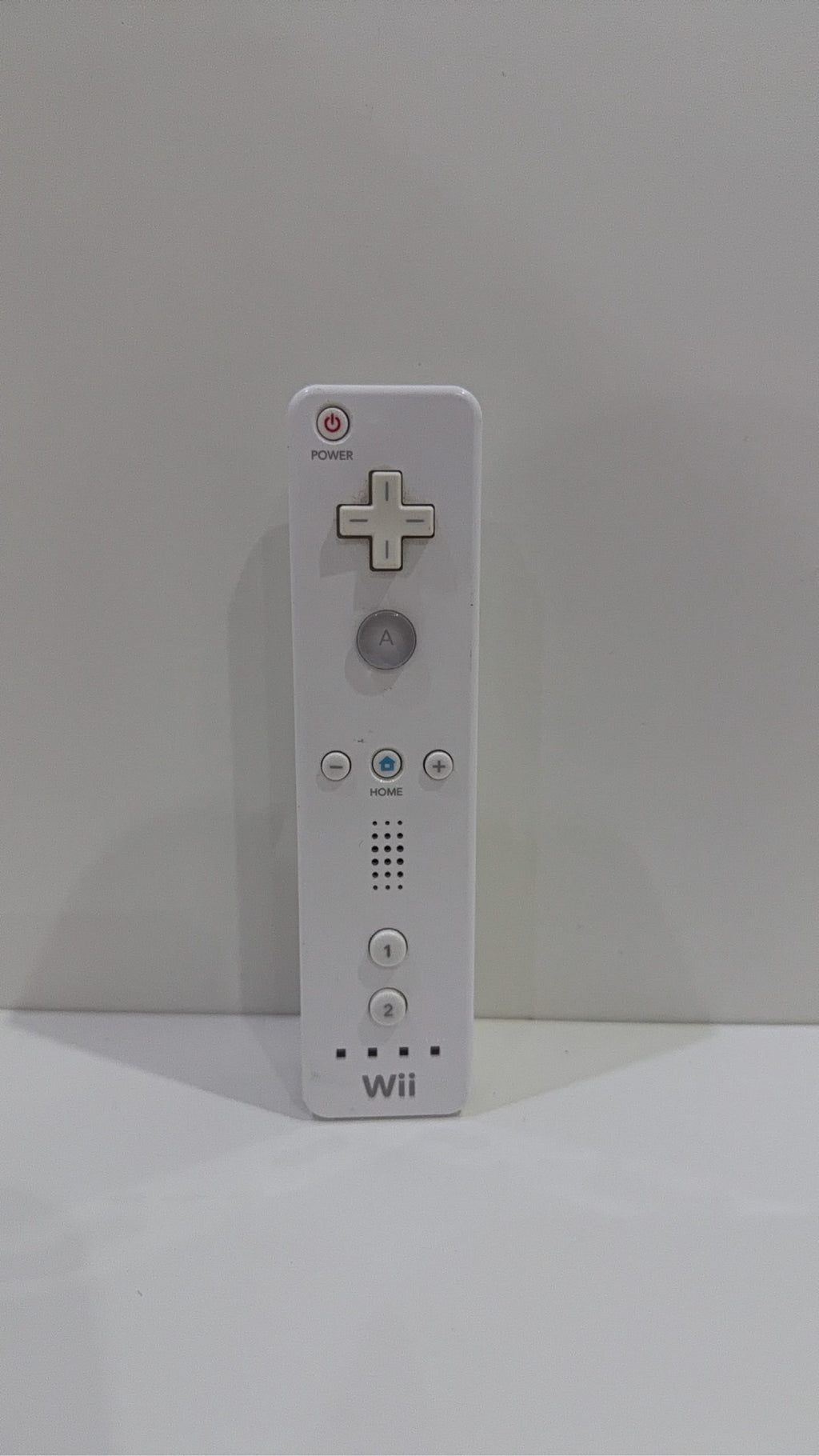 Official Nintendo Wii Remote Controller with light corrosion, tested and cleaned.