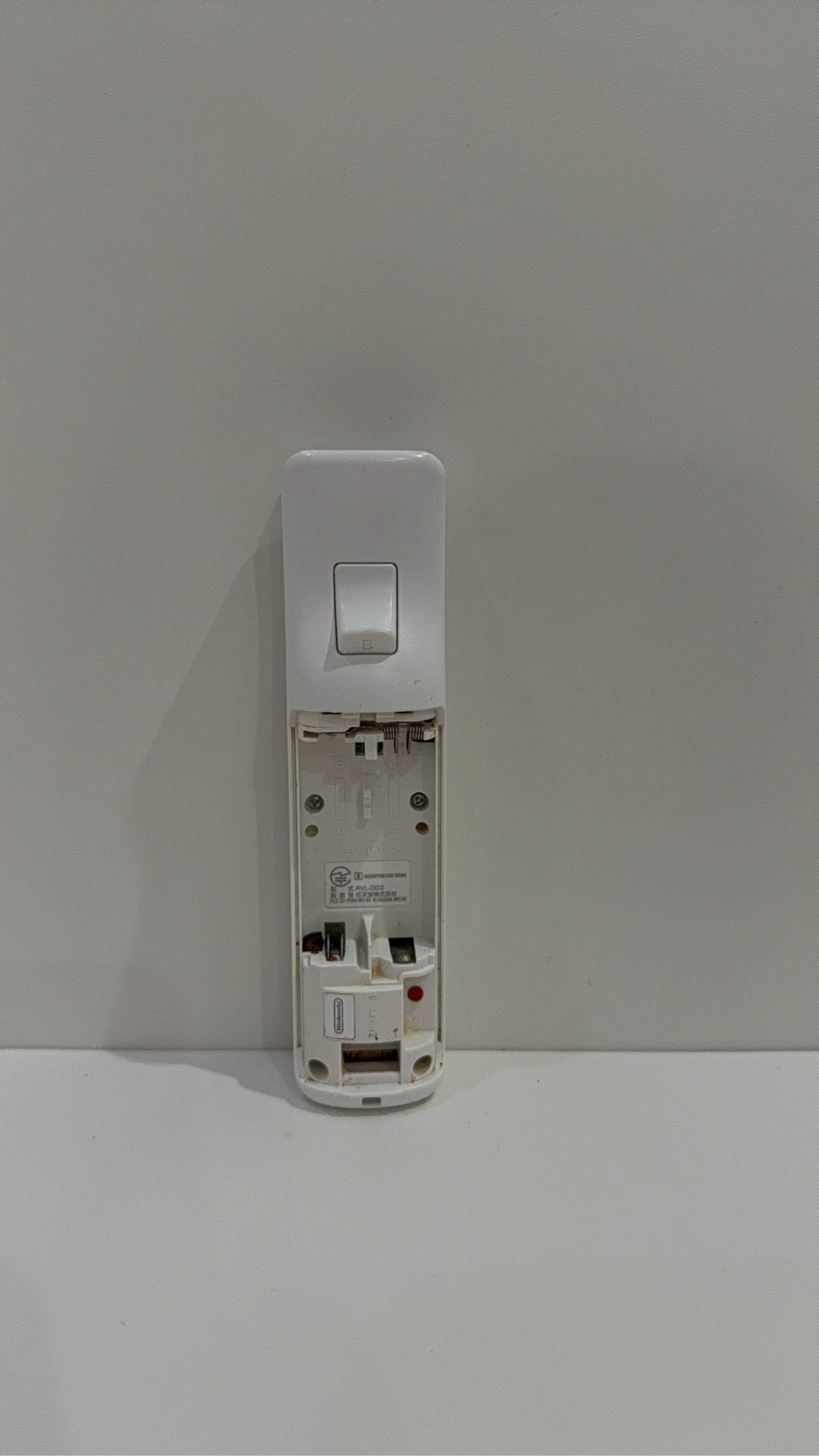 Official Nintendo Wii Remote Controller with light corrosion, tested and cleaned.