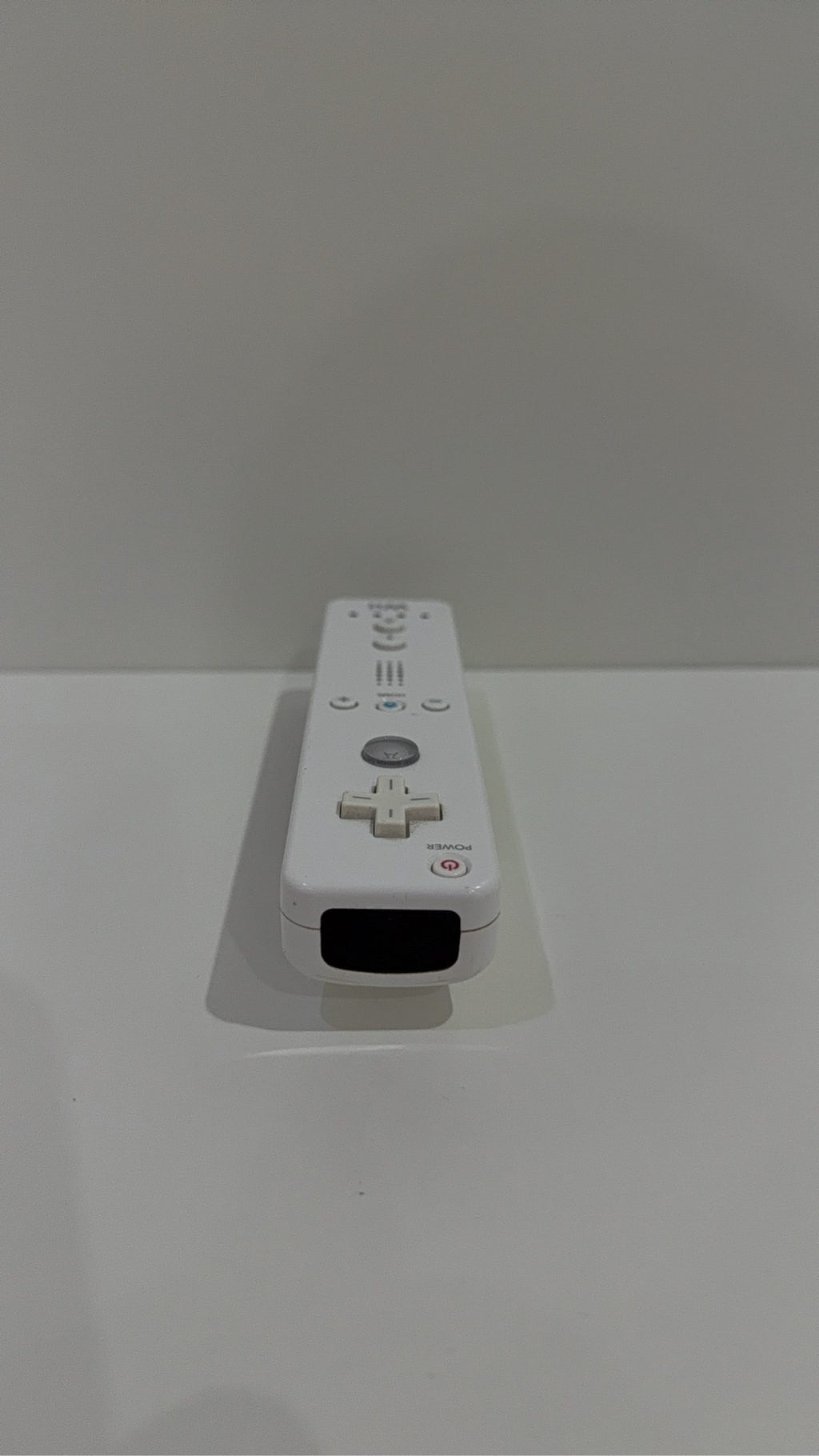 Official Nintendo Wii Remote Controller with light corrosion, tested and cleaned.