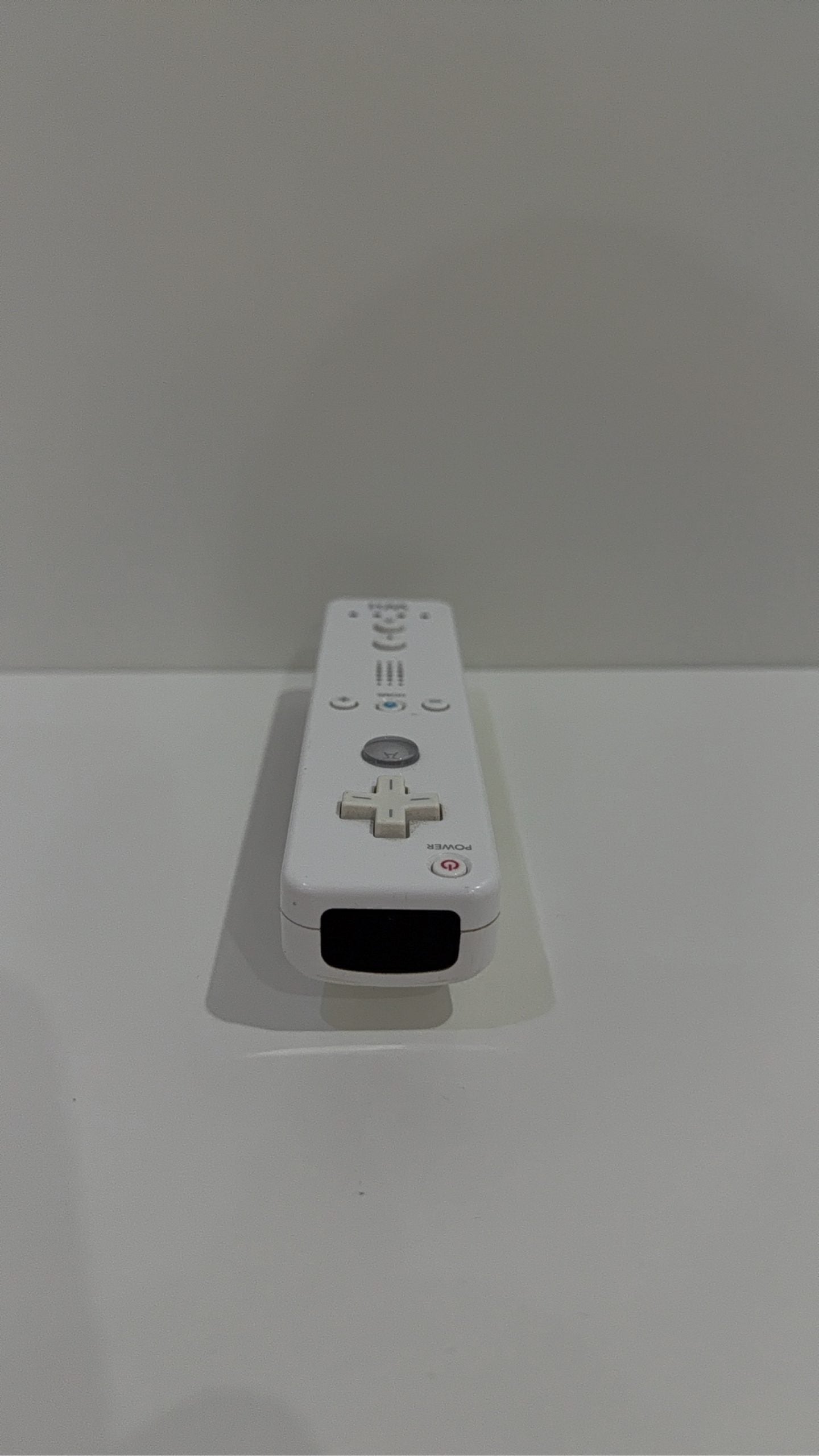 Official Nintendo Wii Remote Controller with light corrosion, tested and cleaned.