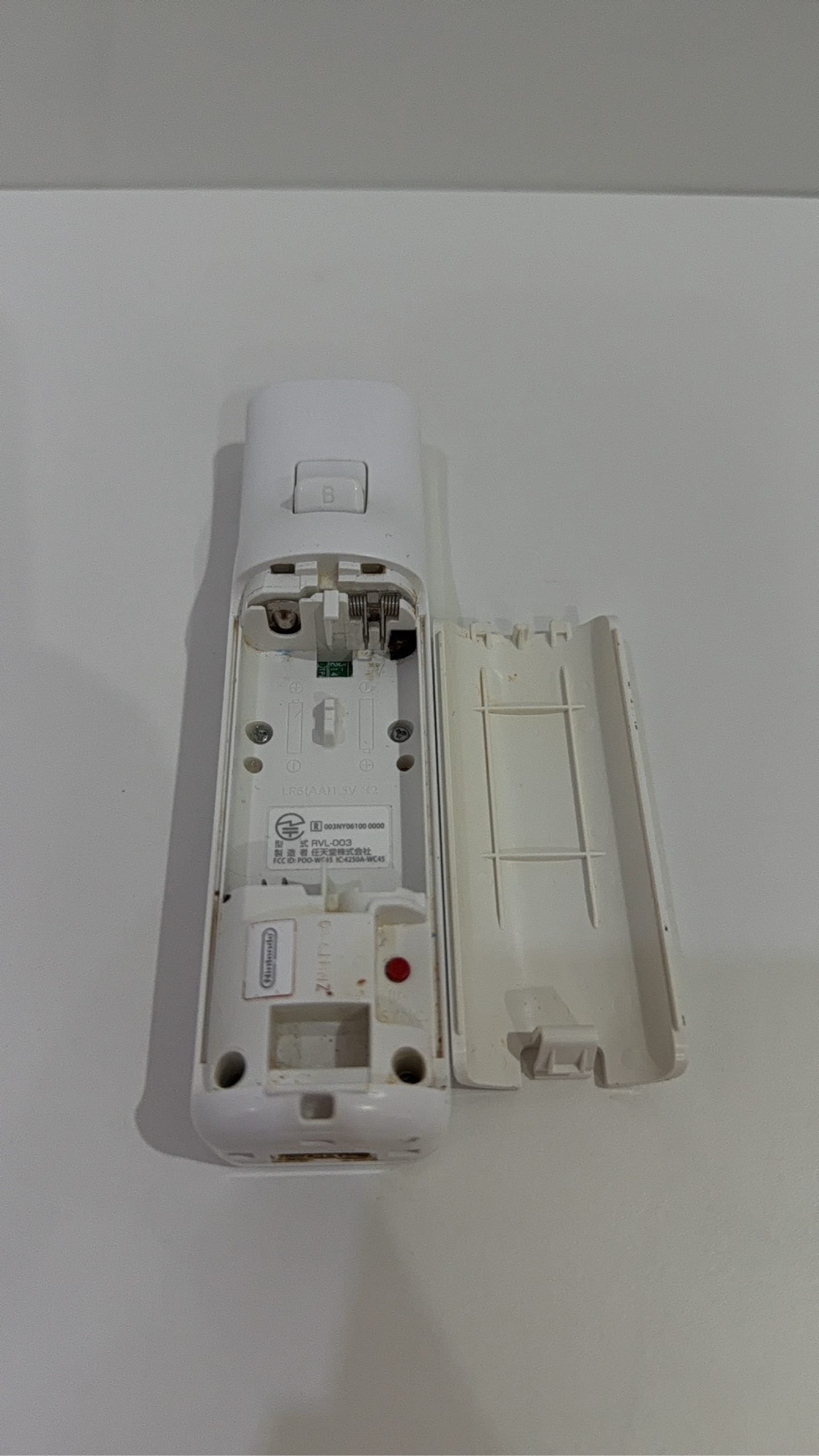 Official Nintendo Wii Remote Controller with light corrosion, tested and cleaned.