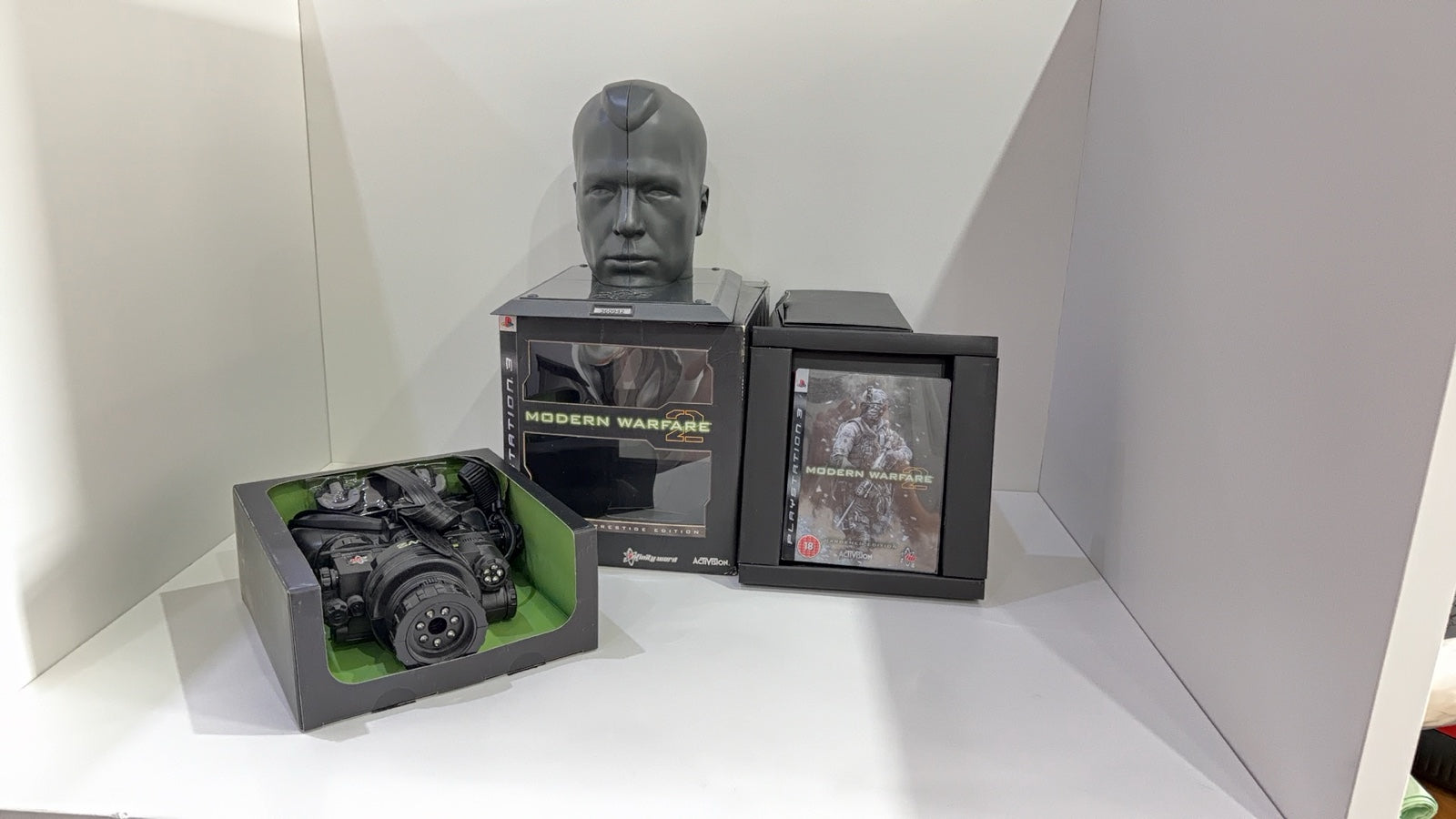 Call of Duty Modern Warfare 2 Prestige Edition PS3 with Night Vision Goggles and display stand.