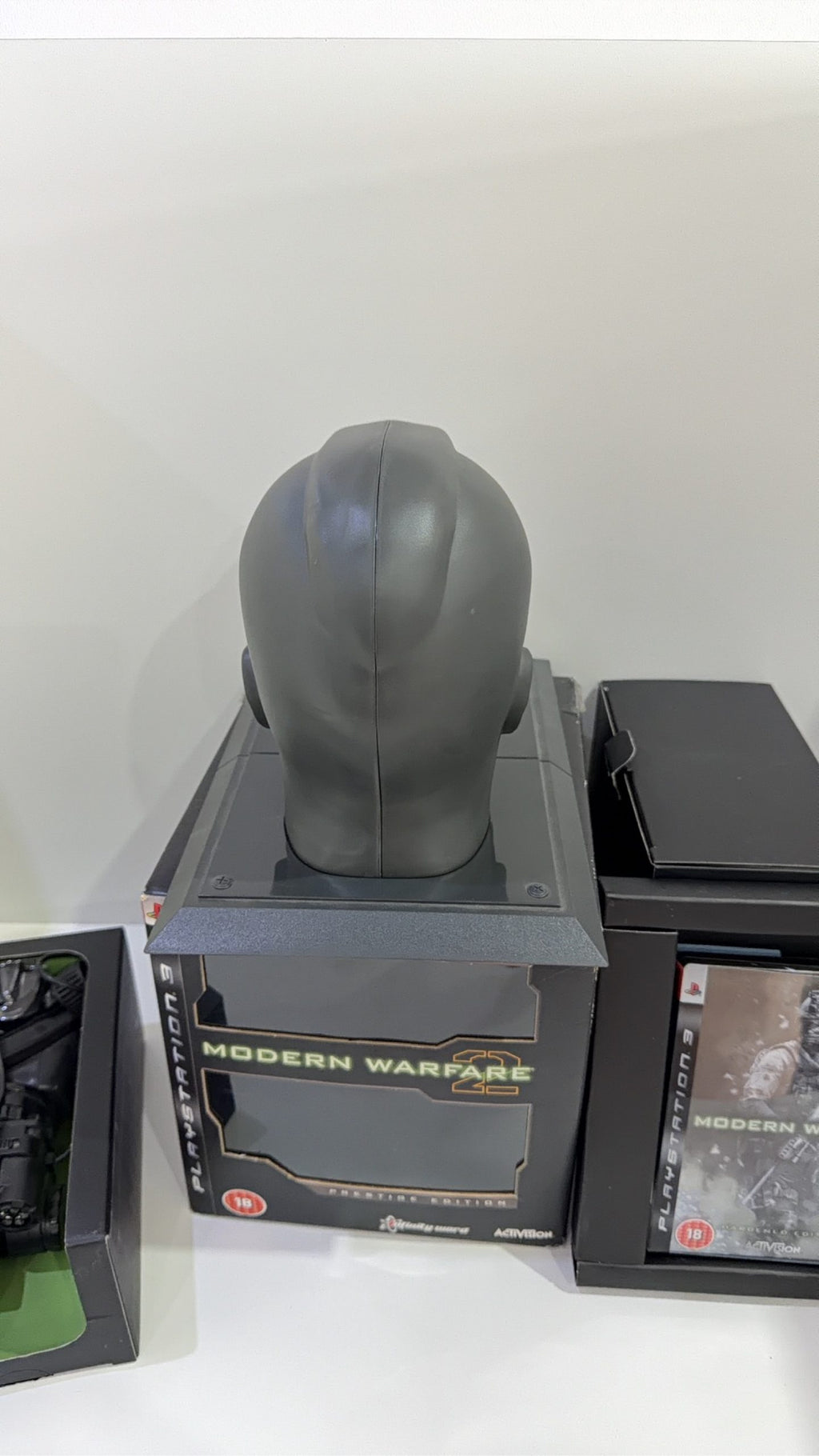 Call of Duty Modern Warfare 2 Prestige Edition PS3 with Night Vision Goggles and display stand.