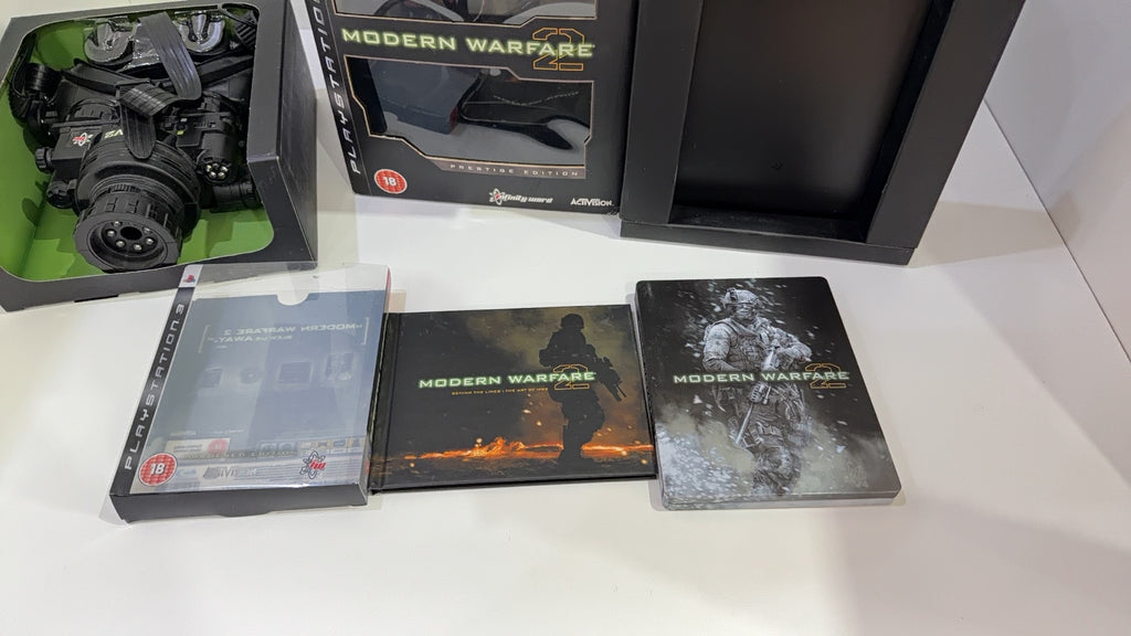 Call of Duty Modern Warfare 2 Prestige Edition PS3 with Night Vision Goggles and display stand.