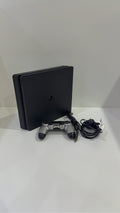 PlayStation 4 Slim PS4 Black 500GB console with official silver Dualshock 4 controller.