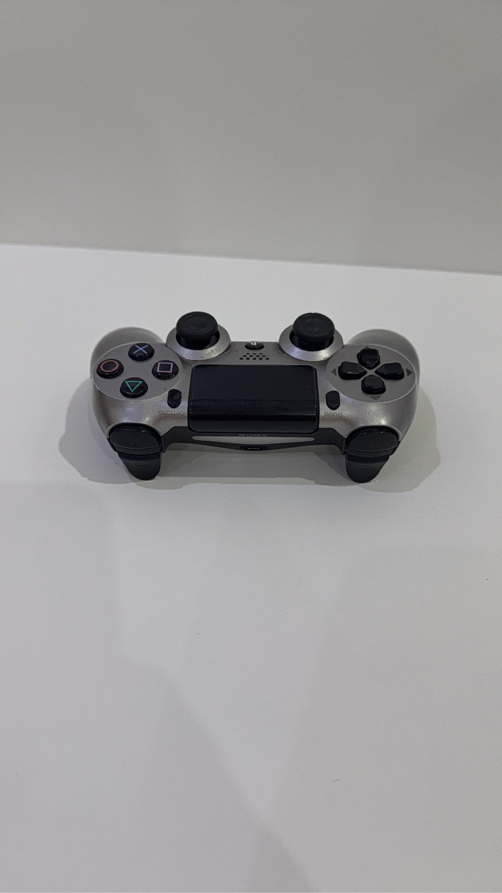 PlayStation 4 Slim PS4 Black 500GB console with official silver Dualshock 4 controller.