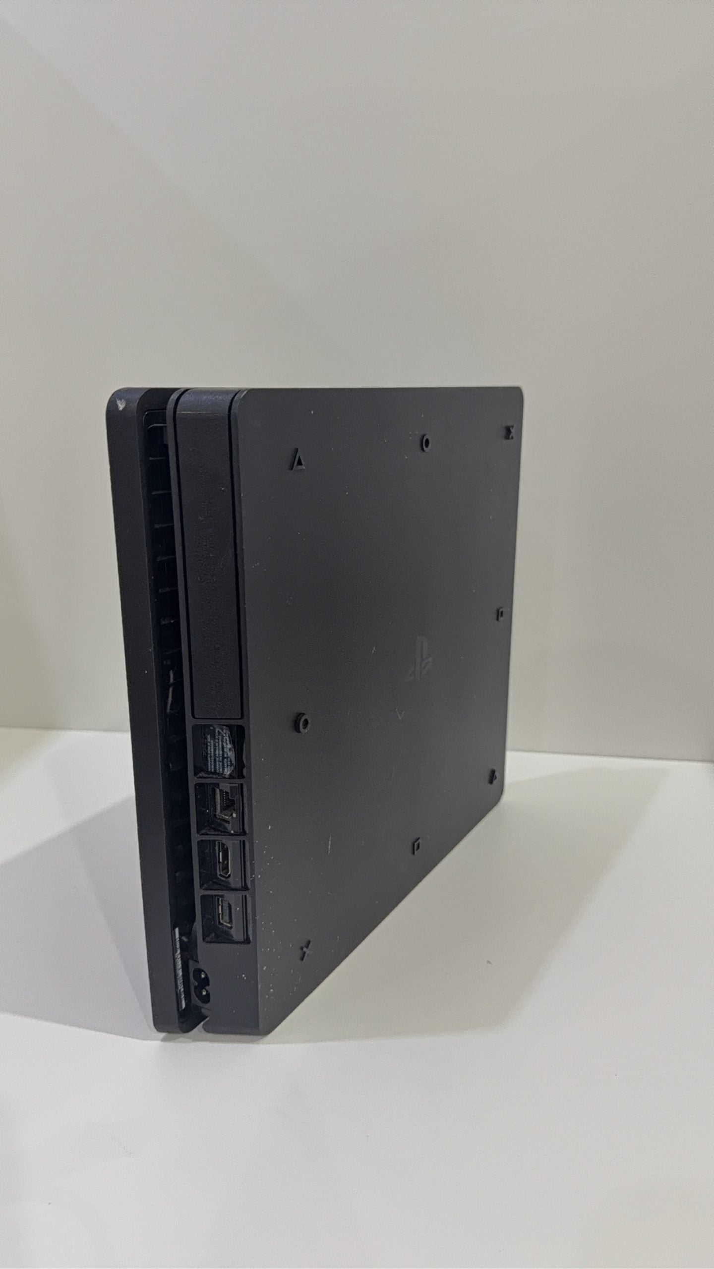 PS4 Slim PlayStation 4 Black 500GB console with official Dualshock 4 controller and cables.