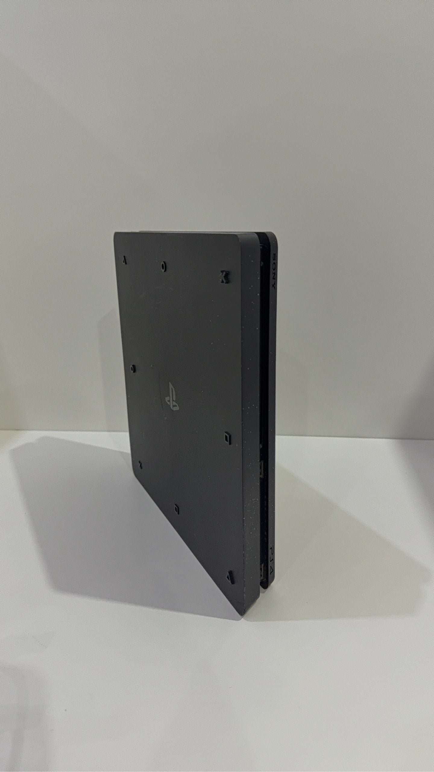 PS4 Slim PlayStation 4 Black 500GB console with official Dualshock 4 controller and cables.