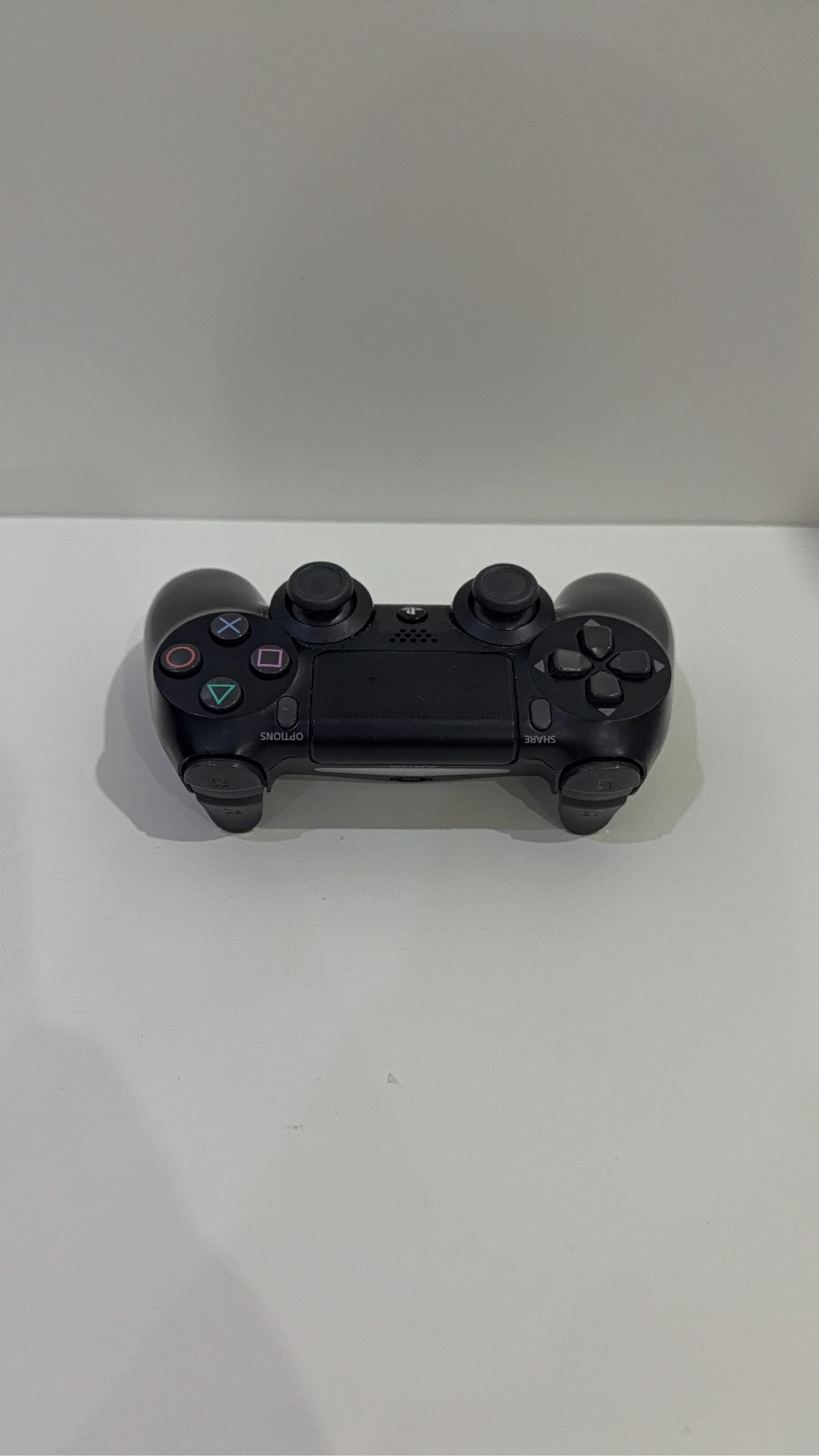 PS4 Slim PlayStation 4 Black 500GB console with official Dualshock 4 controller and cables.