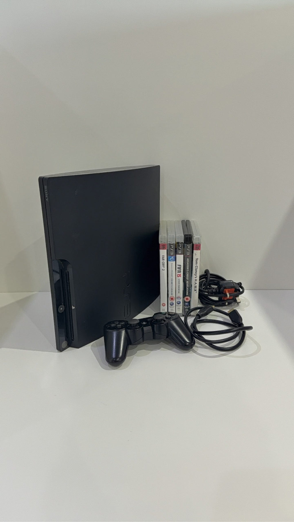 Sony PlayStation 3 320GB Black Console with Controller, cables, and 5 games included.