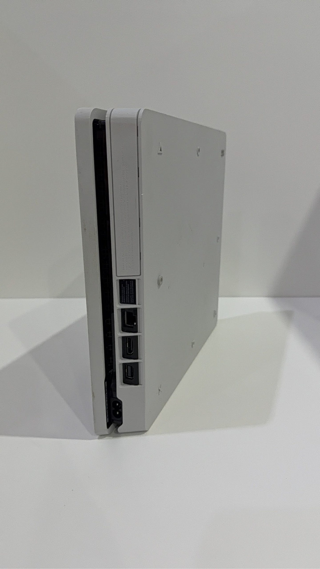 Sony PlayStation 4 Slim White 500GB Console with Controller and Cables, pre-owned gaming system.