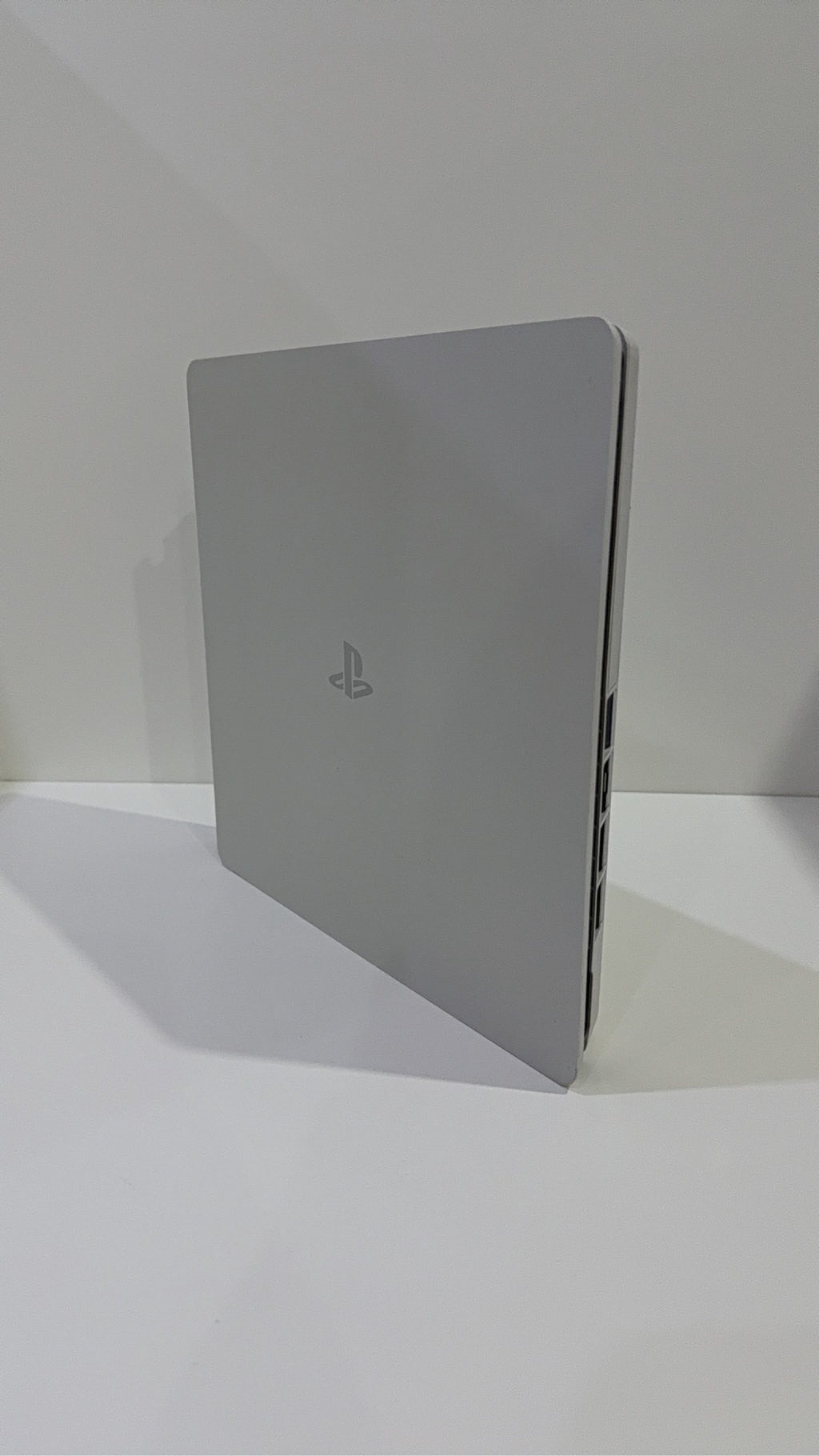 Sony PlayStation 4 Slim White 500GB Console with Controller and Cables, pre-owned gaming system.