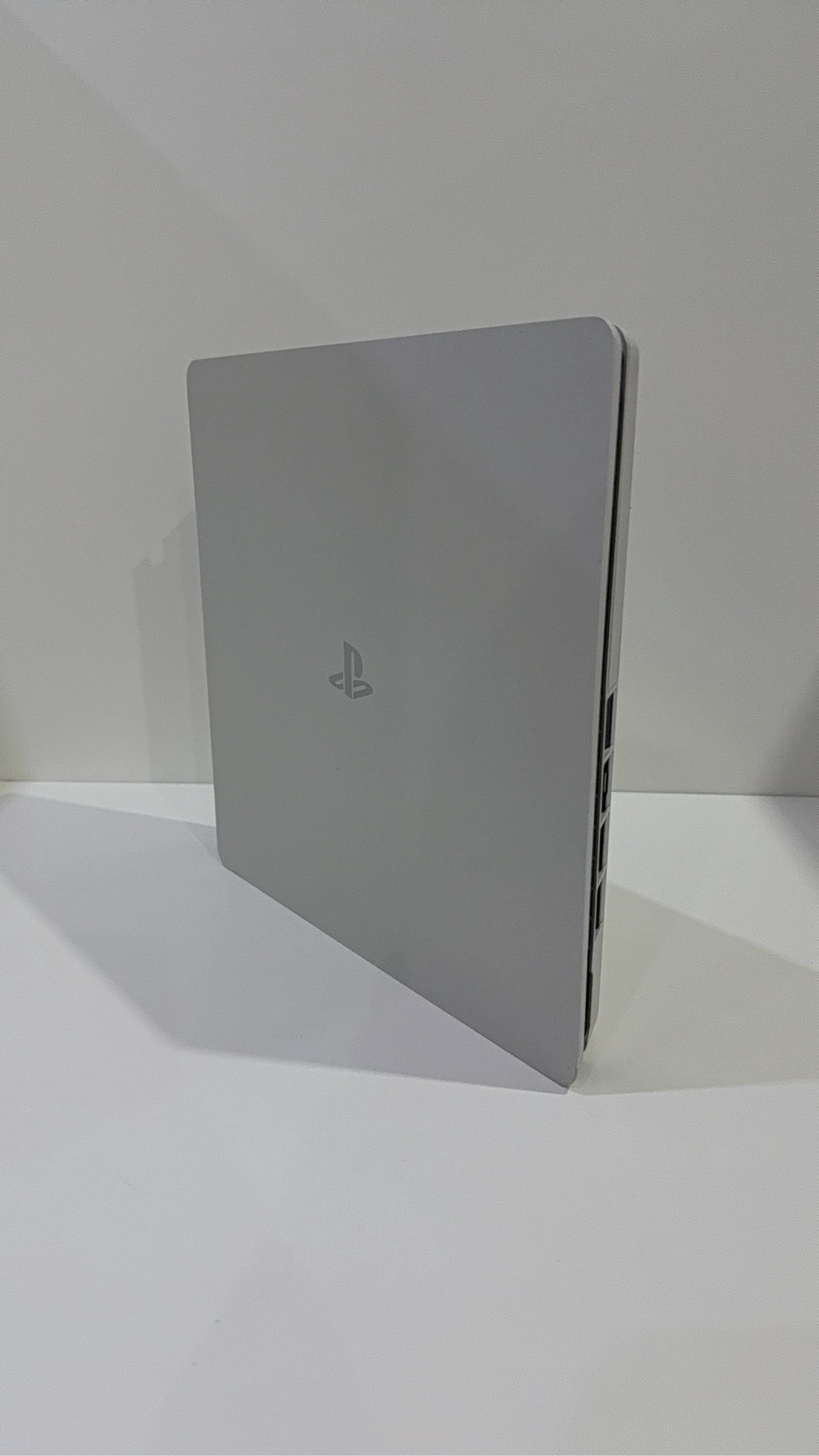 Sony PlayStation 4 Slim White 500GB Console with Controller and Cables, pre-owned gaming system.