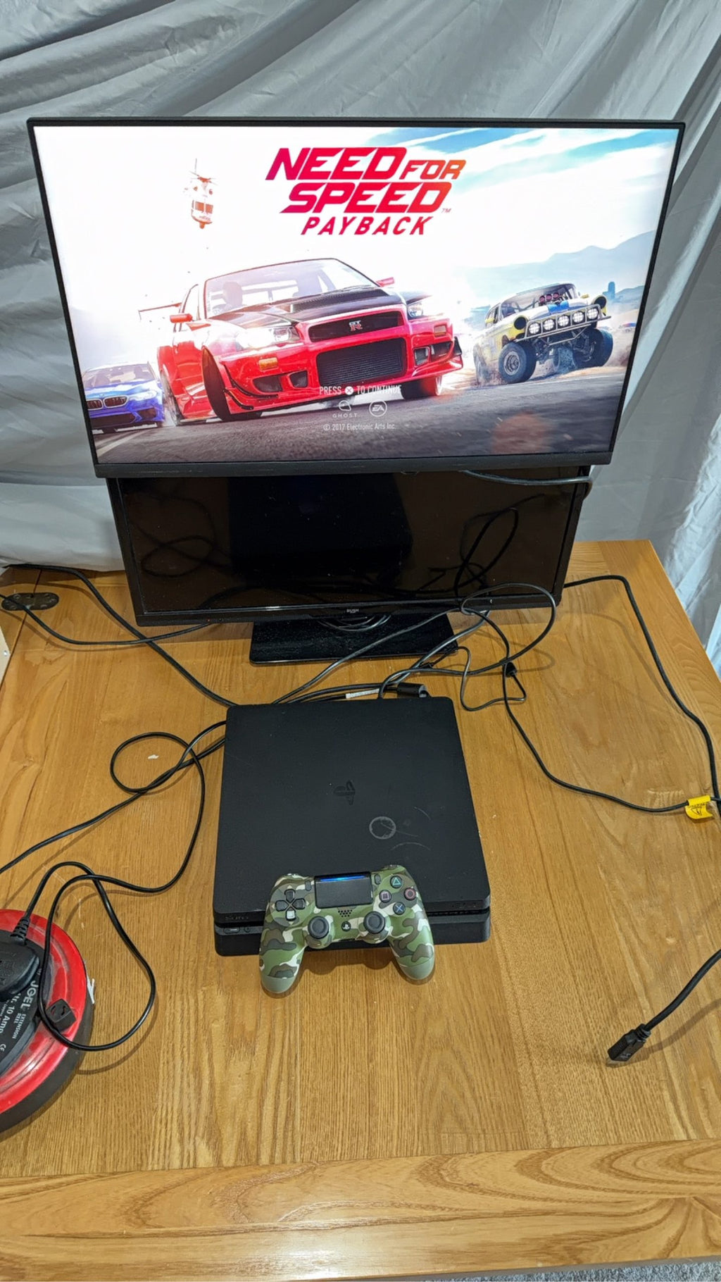 Sony PlayStation 4 Slim 500GB Black Console with Camo Controller and power cables.