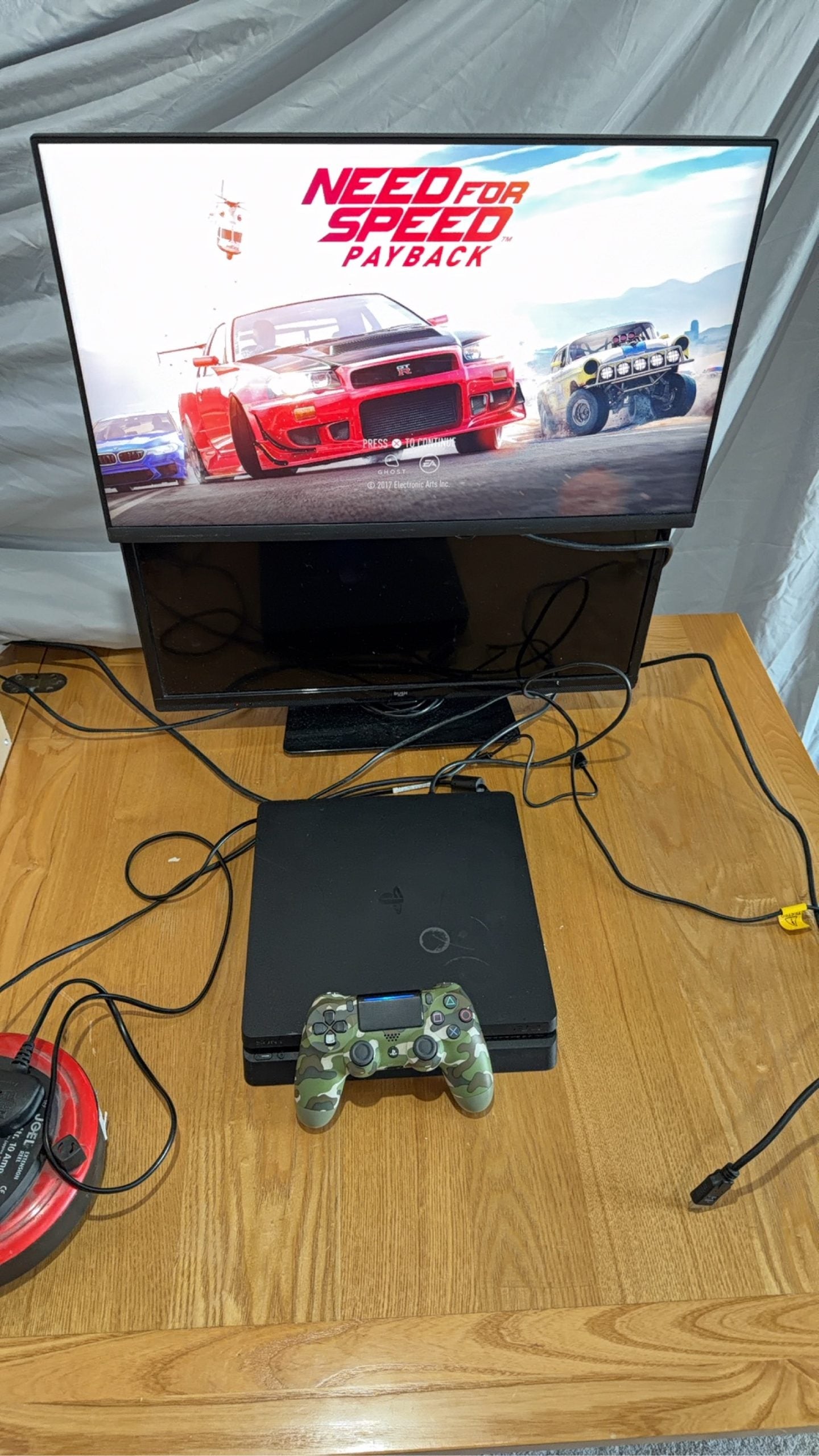 Sony PlayStation 4 Slim 500GB Black Console with Camo Controller and power cables.