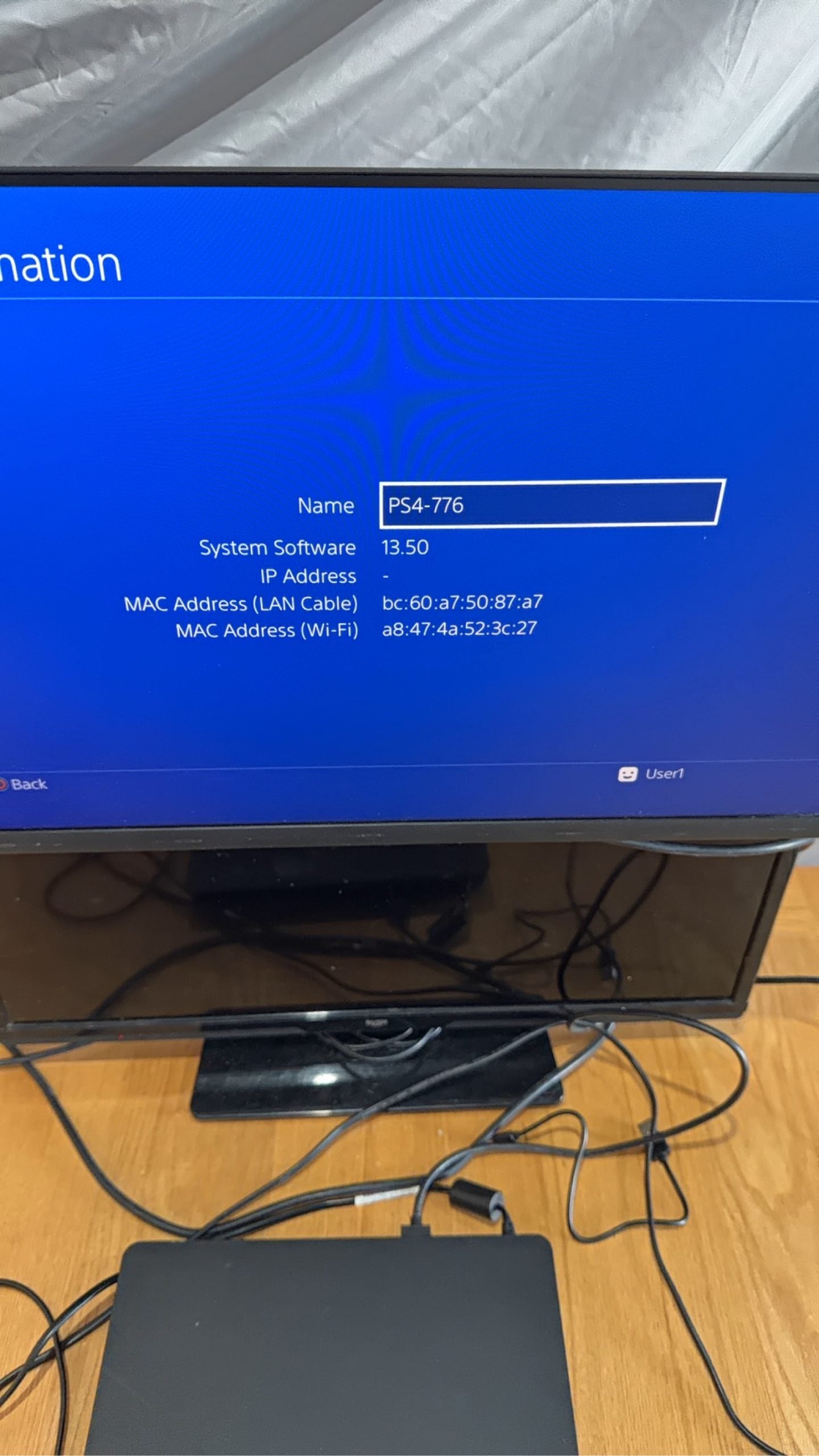Sony PlayStation 4 Slim 500GB Black Console with Camo Controller and power cables.