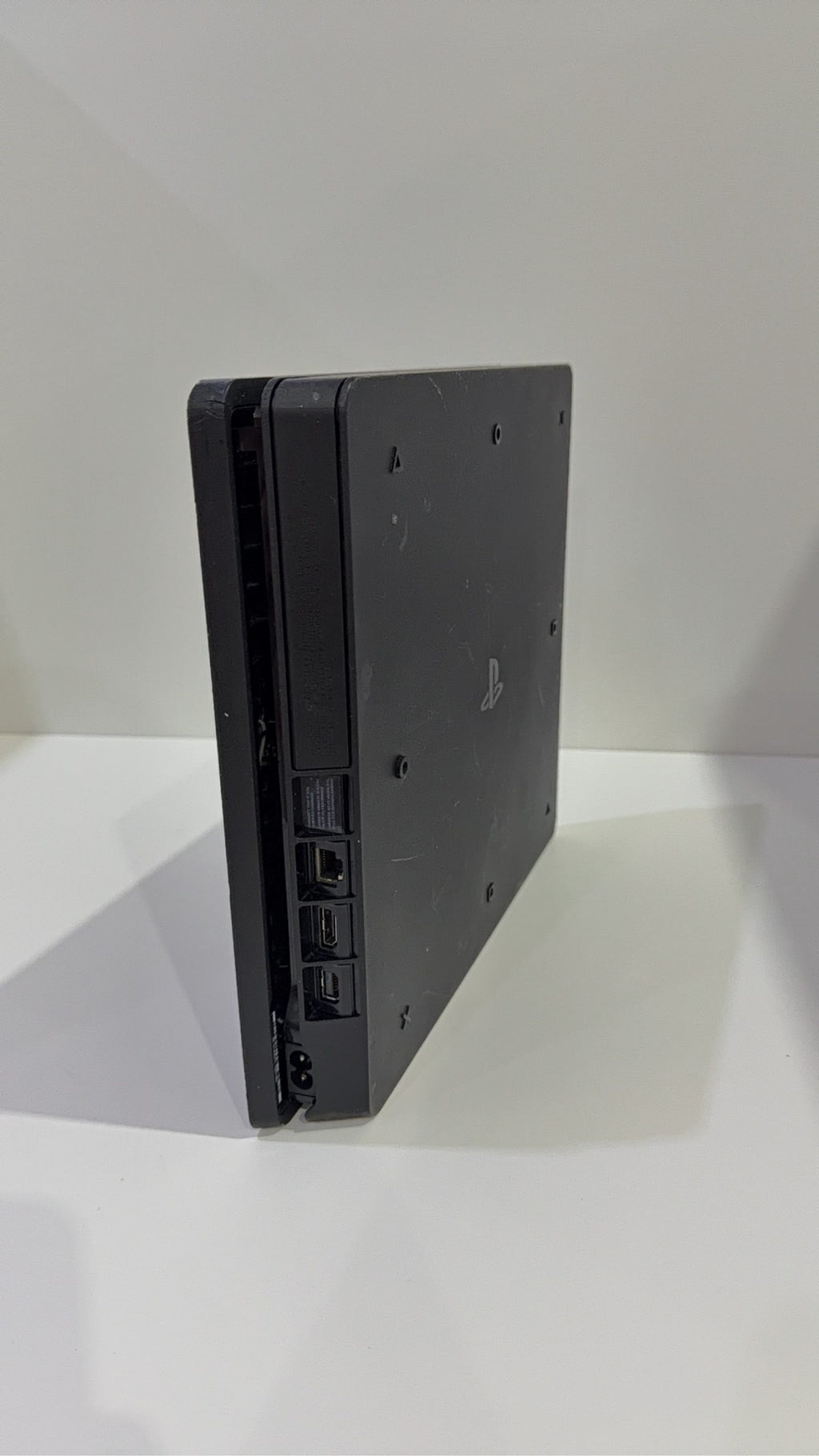 Sony PlayStation 4 Slim 500GB Black Console with Camo Controller and power cables.