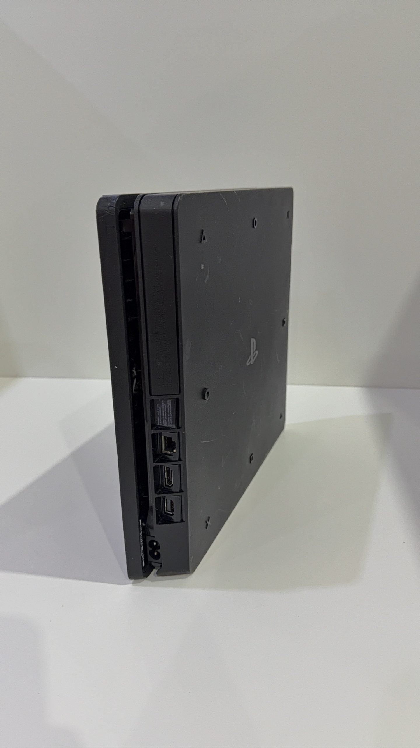 Sony PlayStation 4 Slim 500GB Black Console with Camo Controller and power cables.