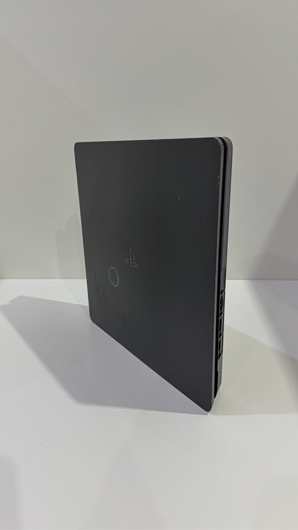 Sony PlayStation 4 Slim 500GB Black Console with Camo Controller and power cables.