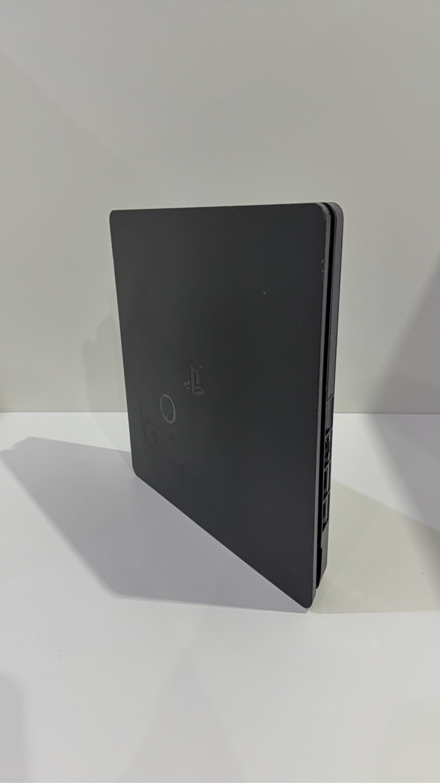 Sony PlayStation 4 Slim 500GB Black Console with Camo Controller and power cables.