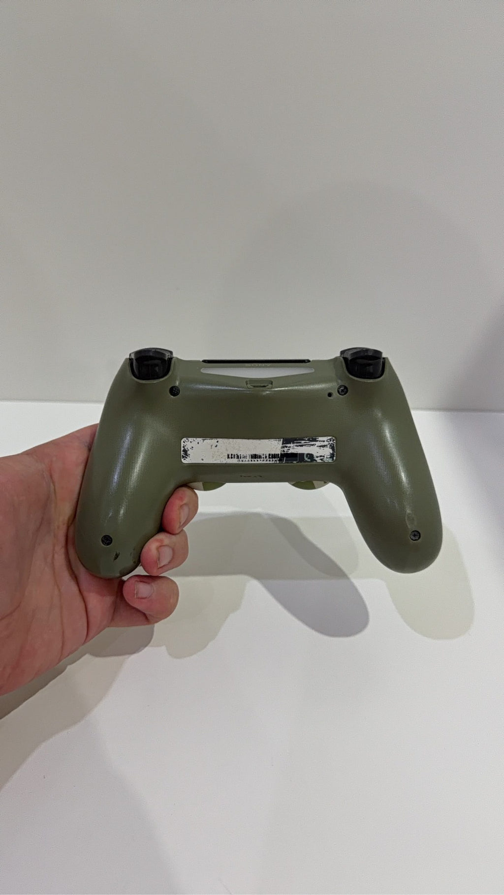 Sony PlayStation 4 Slim 500GB Black Console with Camo Controller and power cables.