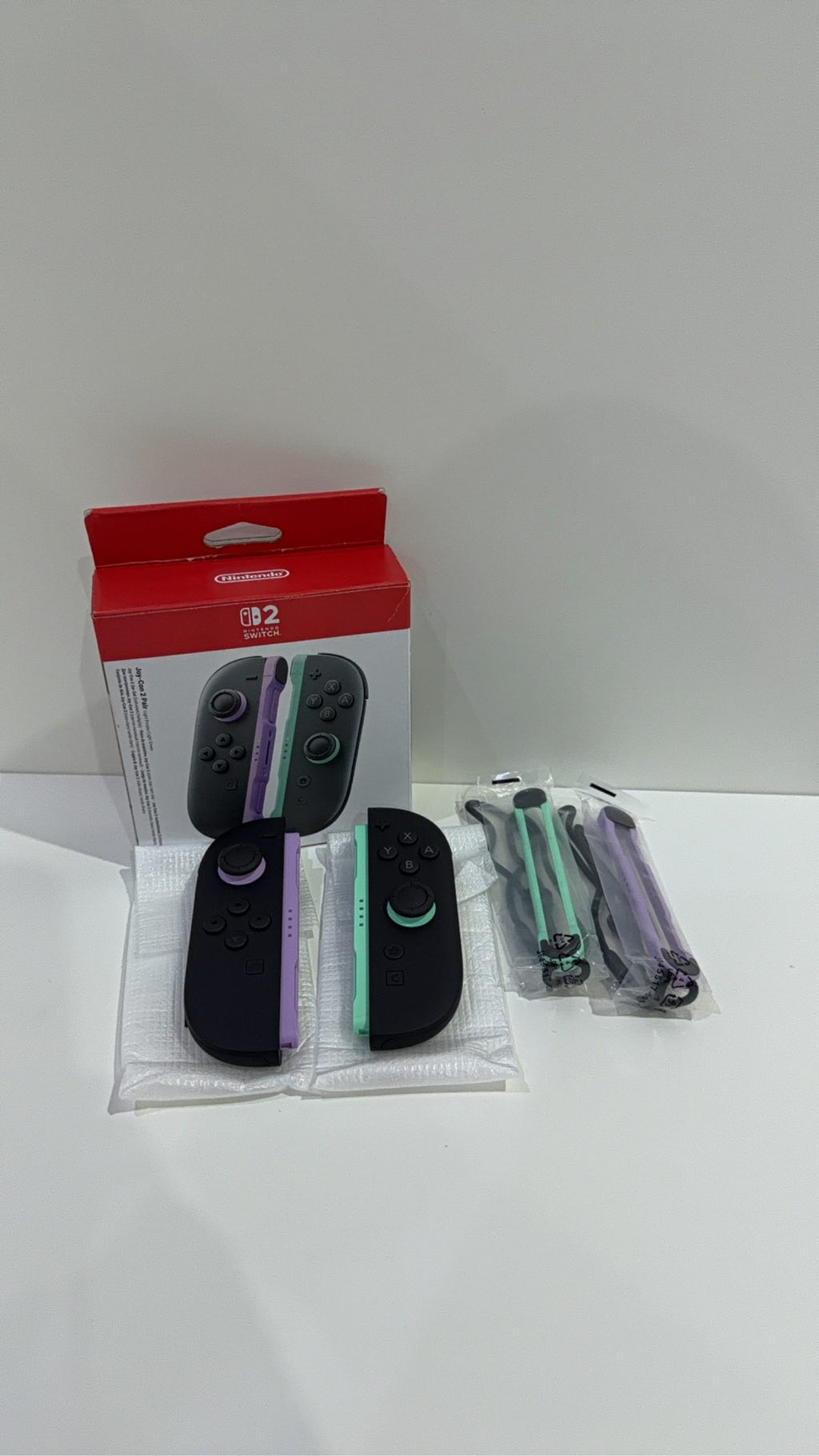 Nintendo Switch 2 Joy-Con Controller Pair in Purple and Green, fully tested and working.