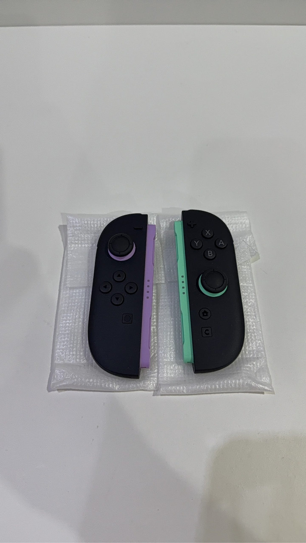 Nintendo Switch 2 Joy-Con Controller Pair in Purple and Green, fully tested and working.