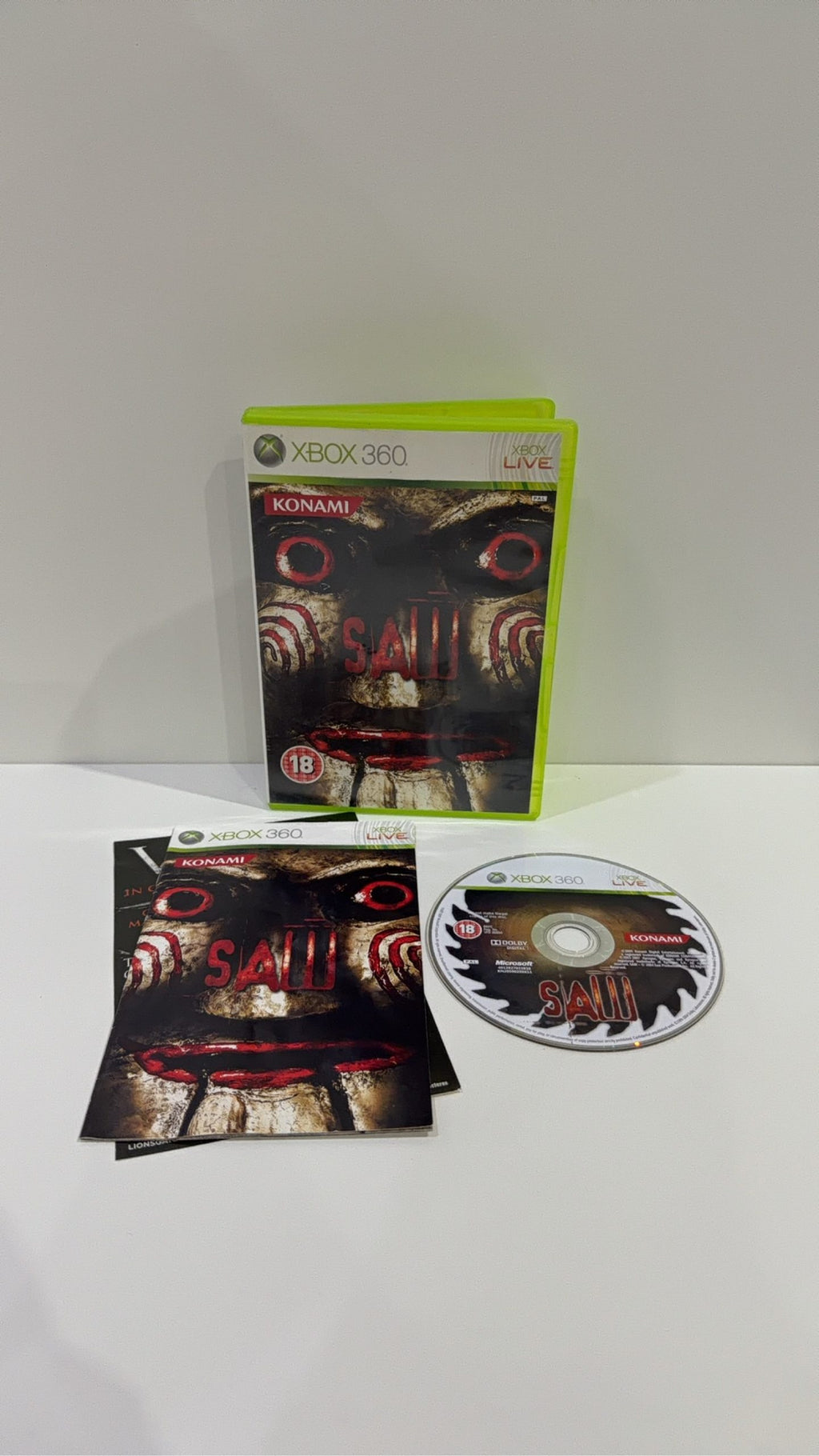 Saw The Video Game for Xbox 360, complete with manual, original case, and cover artwork.