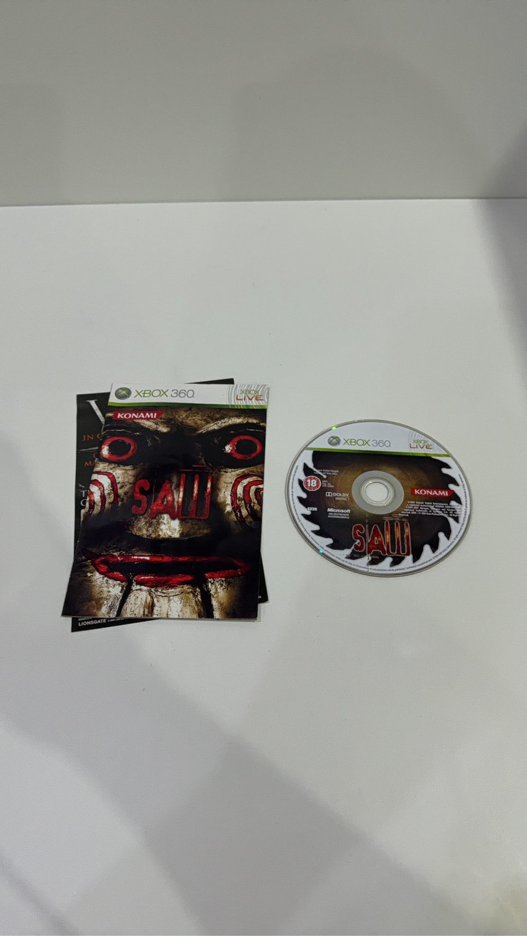Saw The Video Game for Xbox 360, complete with manual, original case, and cover artwork.