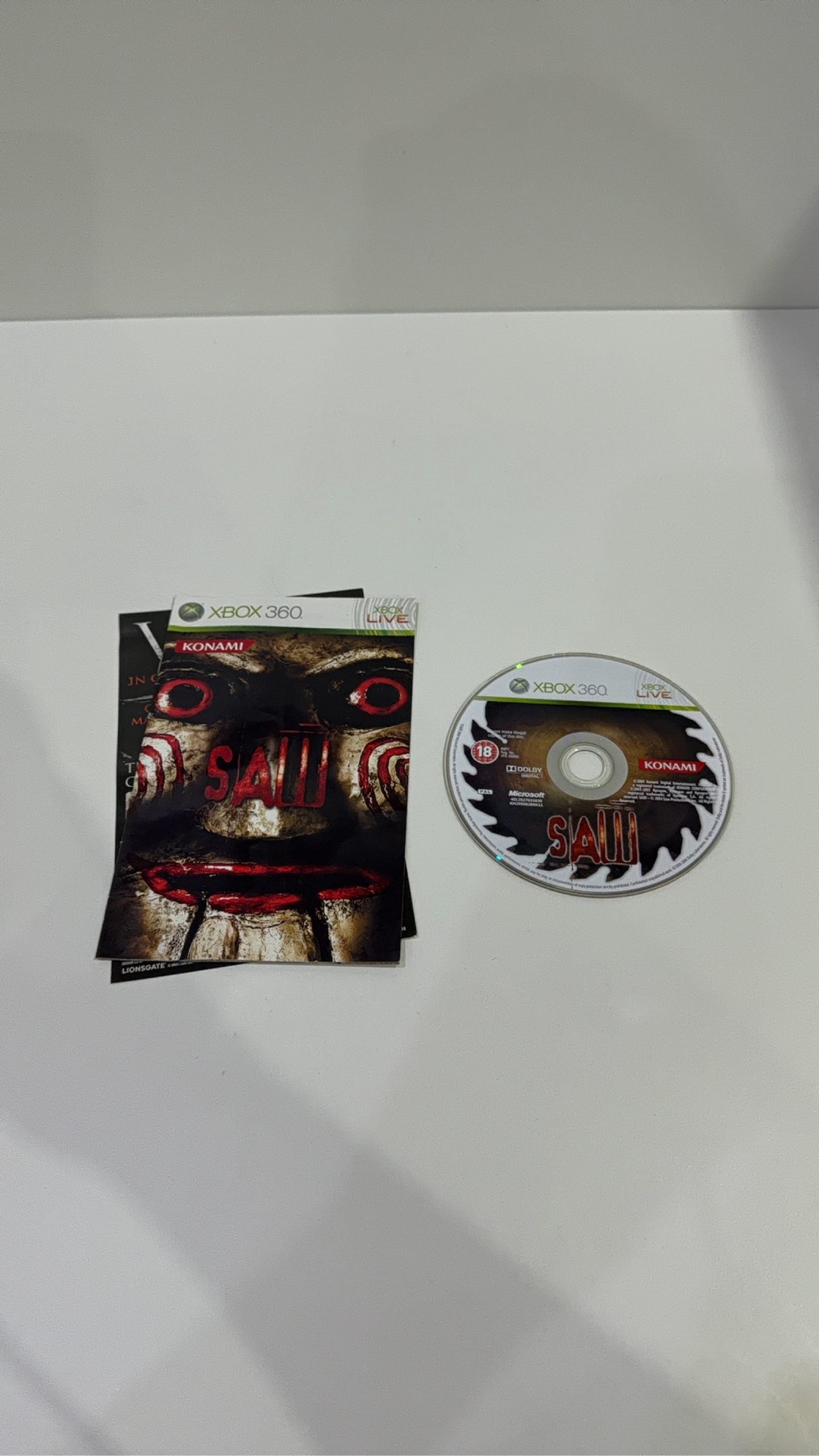 Saw The Video Game for Xbox 360, complete with manual, original case, and cover artwork.