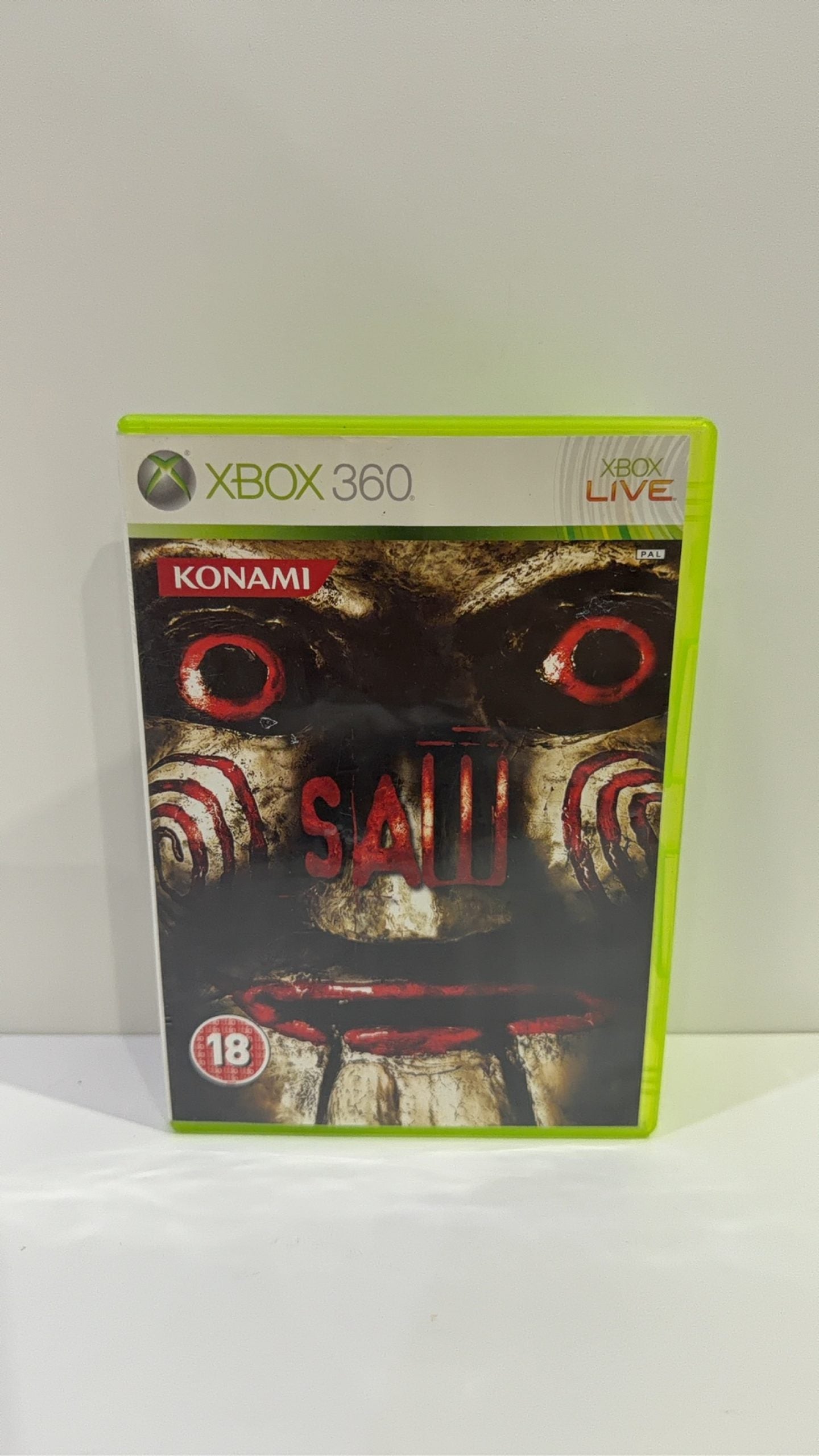 Saw The Video Game for Xbox 360, complete with manual, original case, and cover artwork.