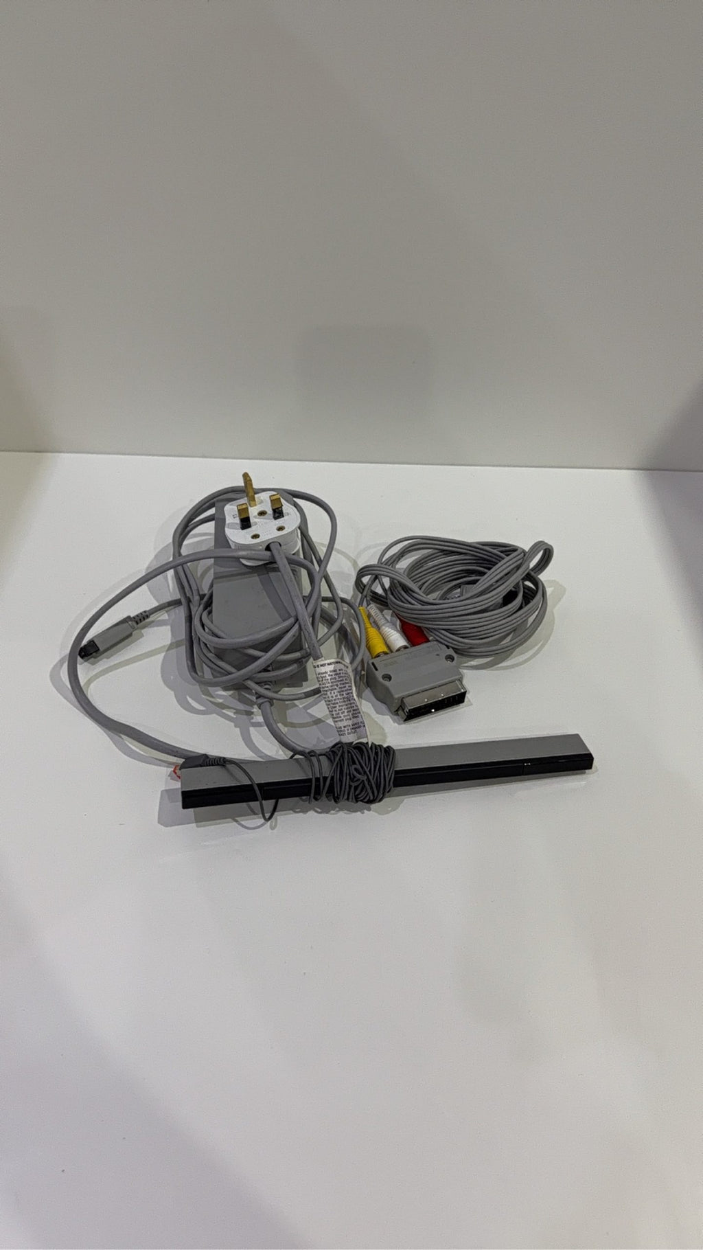 Nintendo Wii Console White Wii Fit Plus Bundle with accessories and games, tested in very good condition.