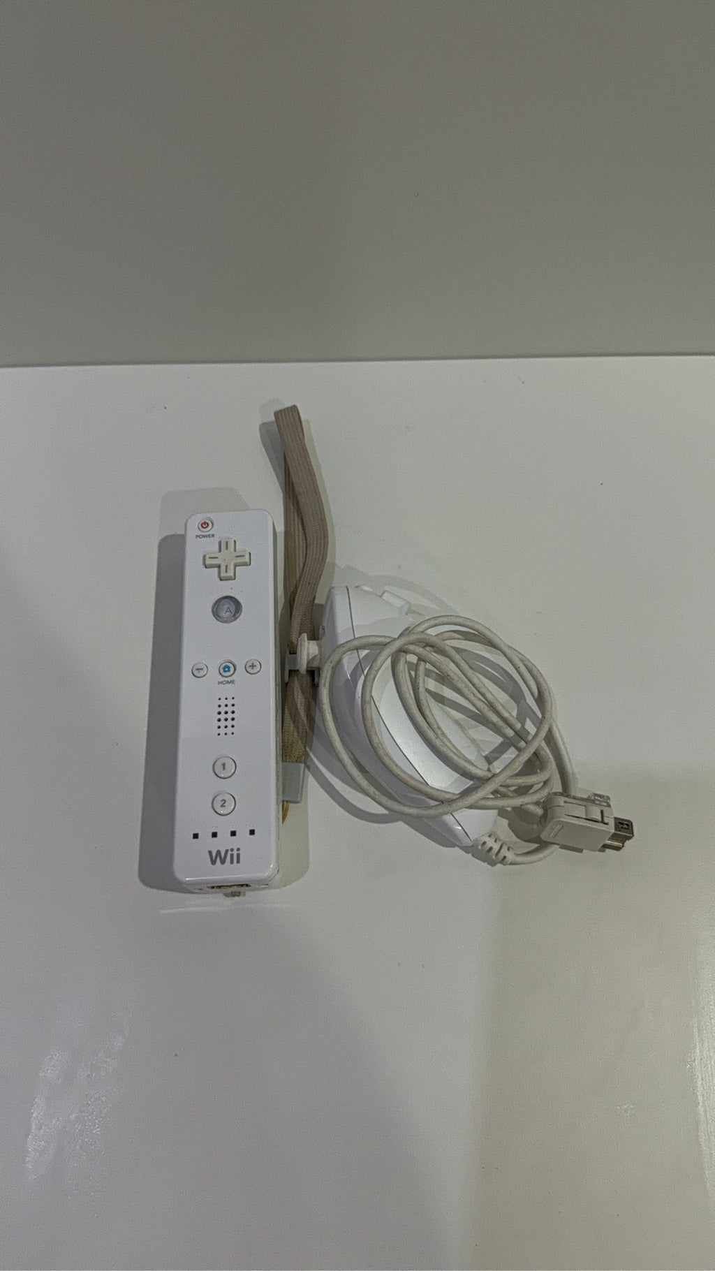 Nintendo Wii Console White Wii Fit Plus Bundle with accessories and games, tested in very good condition.