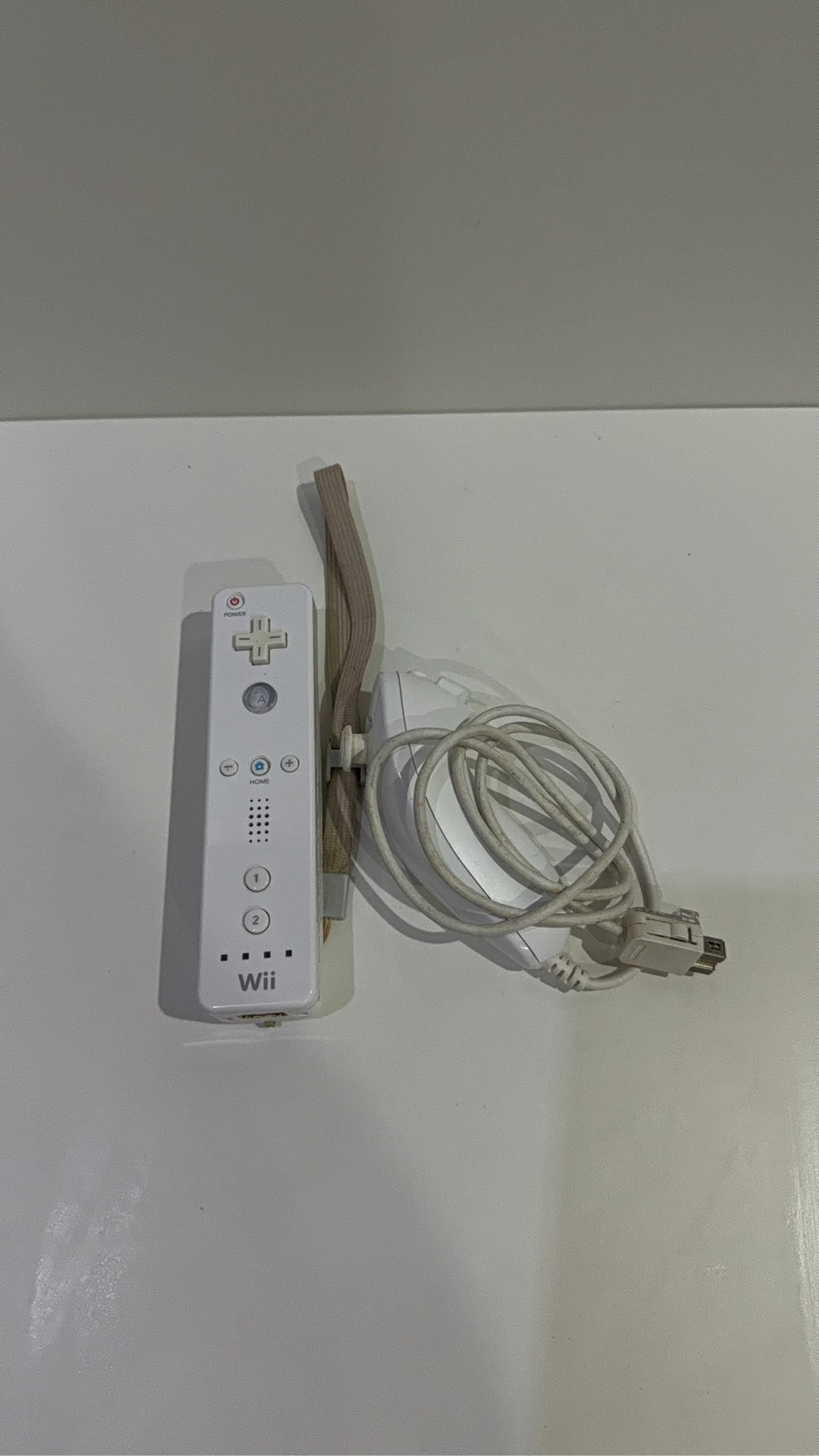 Nintendo Wii Console White Wii Fit Plus Bundle with accessories and games, tested in very good condition.